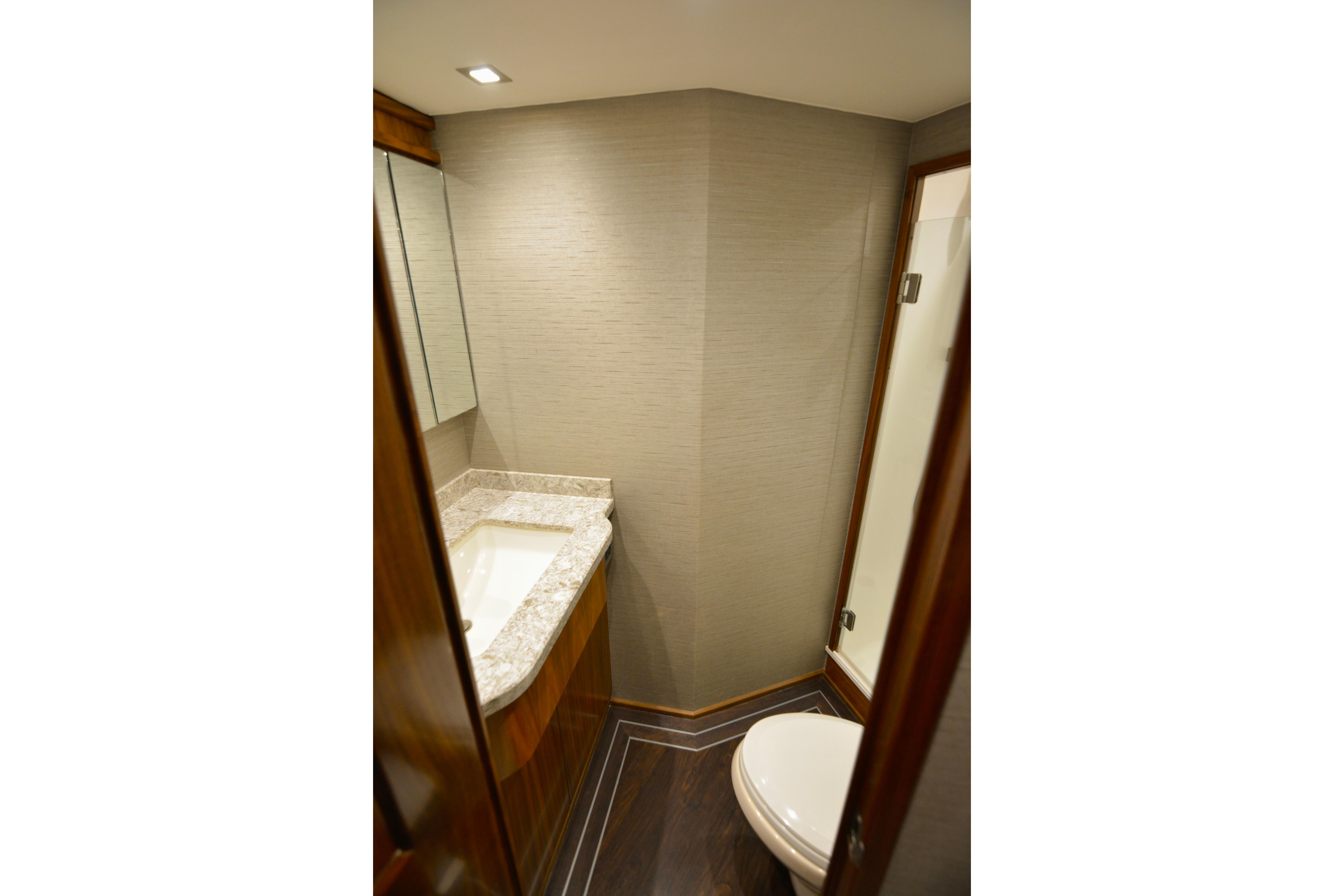 Luxurious bathroom in 2019 Viking 68 Convertible yacht with modern fixtures and elegant design.