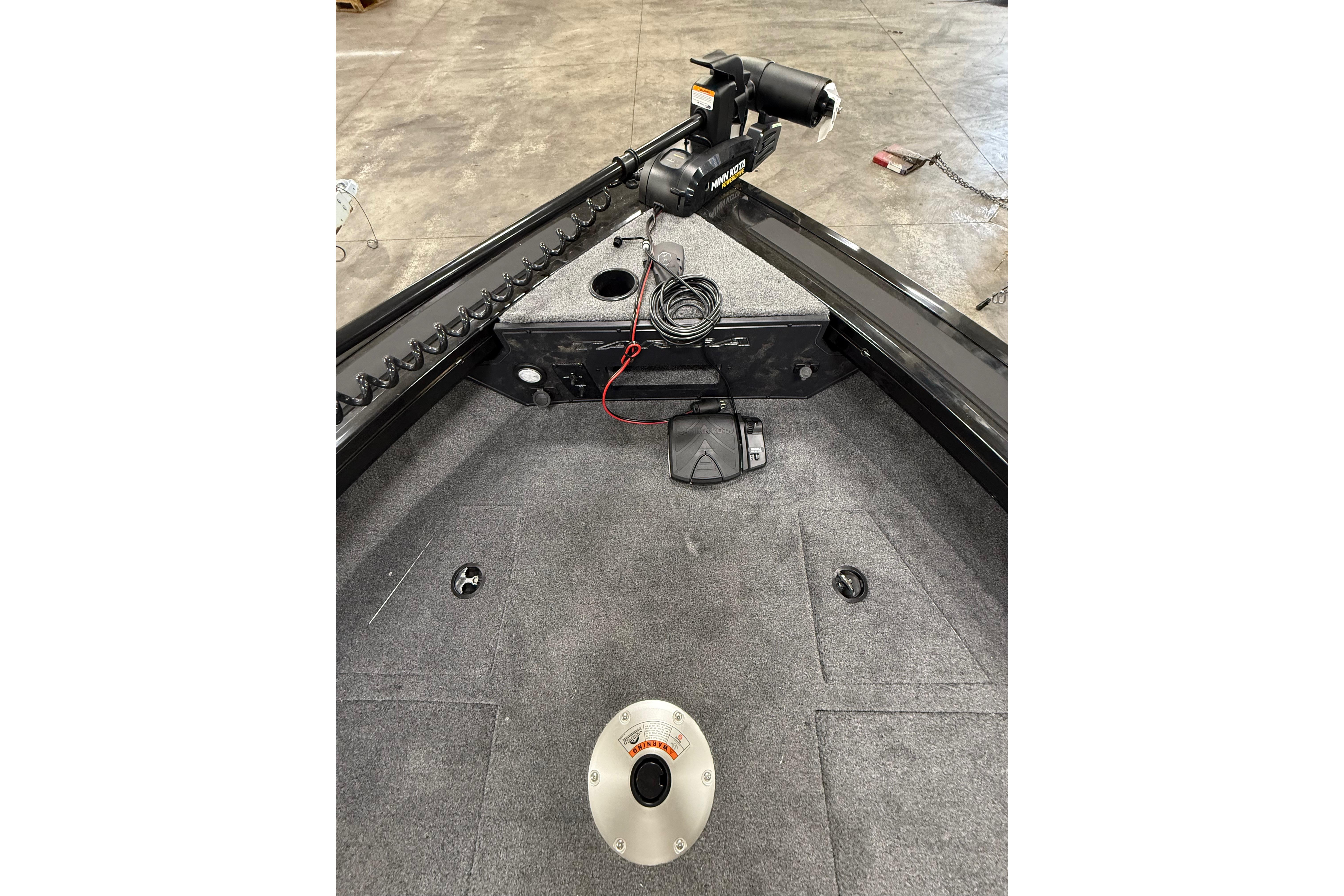 2026 Tracker Targa V-19 WT boat interior with trolling motor and carpeted deck.