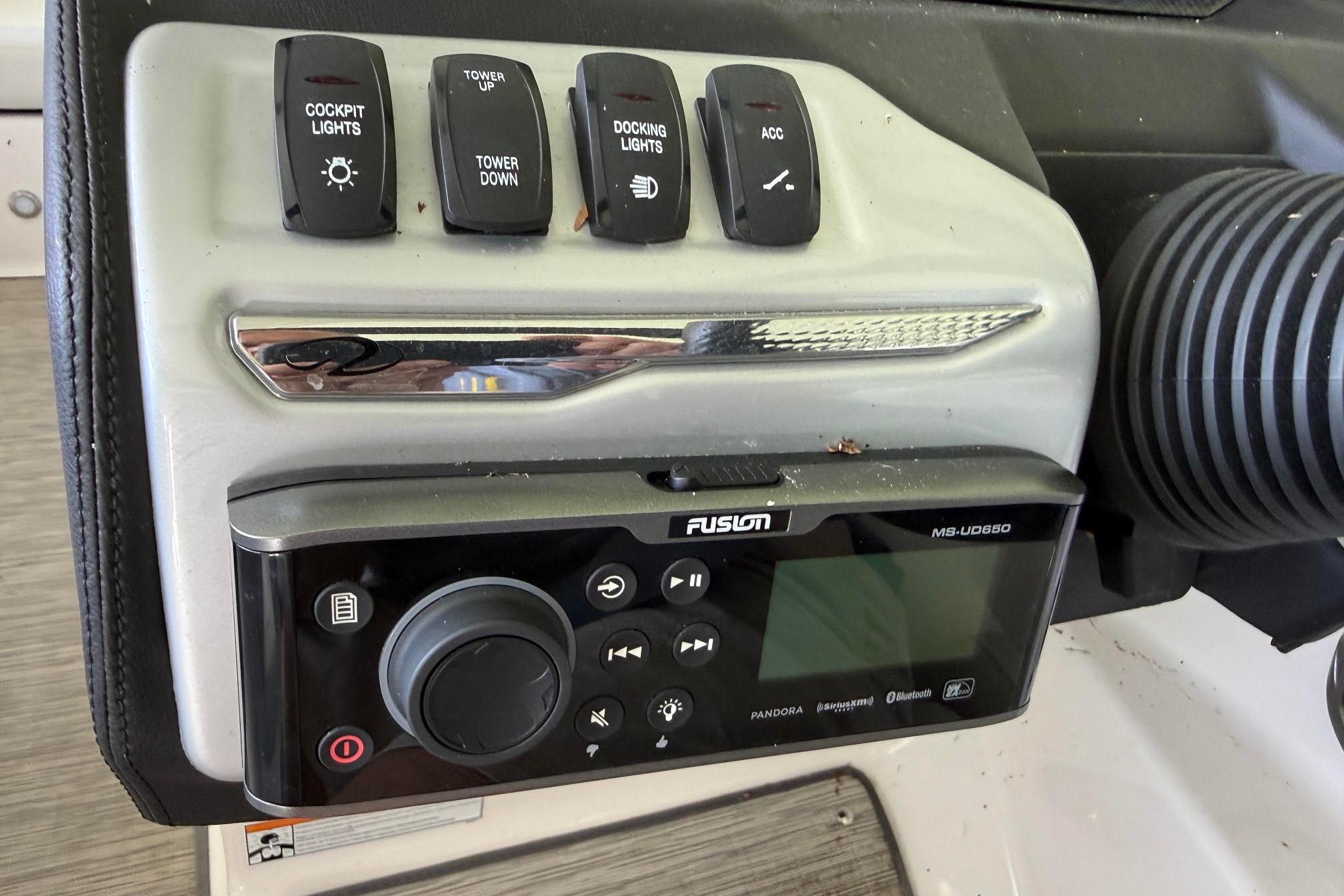 Control panel of a 2016 Regal 1900 ES Bowrider with Fusion MS-UD650 audio system.