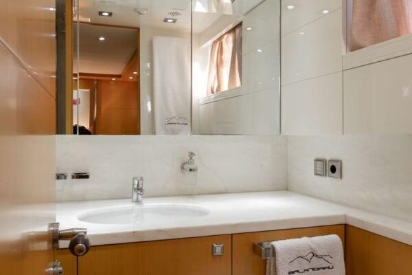 Luxurious bathroom in 2009 Maiora 31DP yacht with modern fixtures and elegant design.