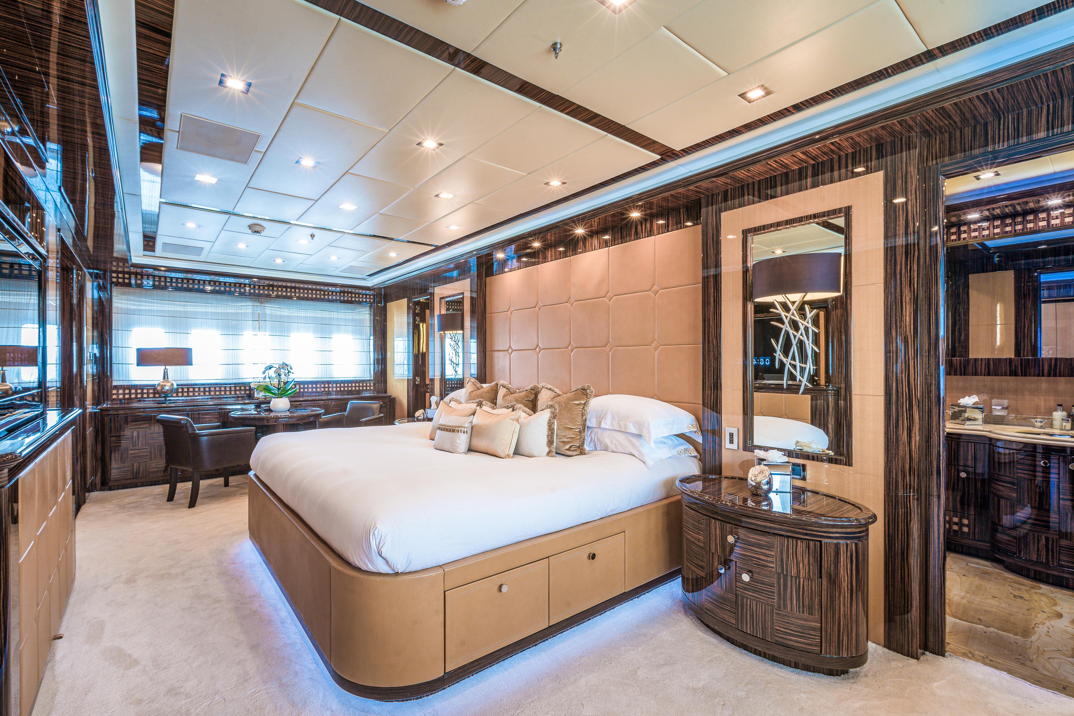Luxurious interior of 2011 Mangusta 165 yacht with elegant bedroom design.