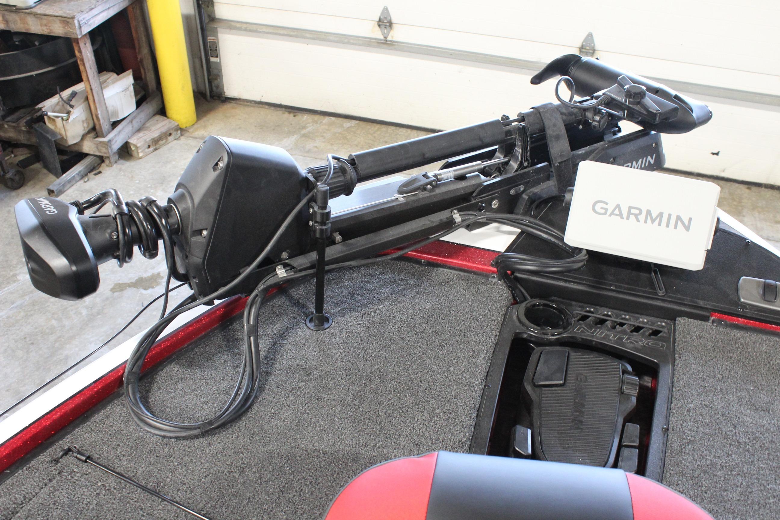 2026 Nitro Z19 XL Pro boat with Garmin trolling motor in a garage setting.