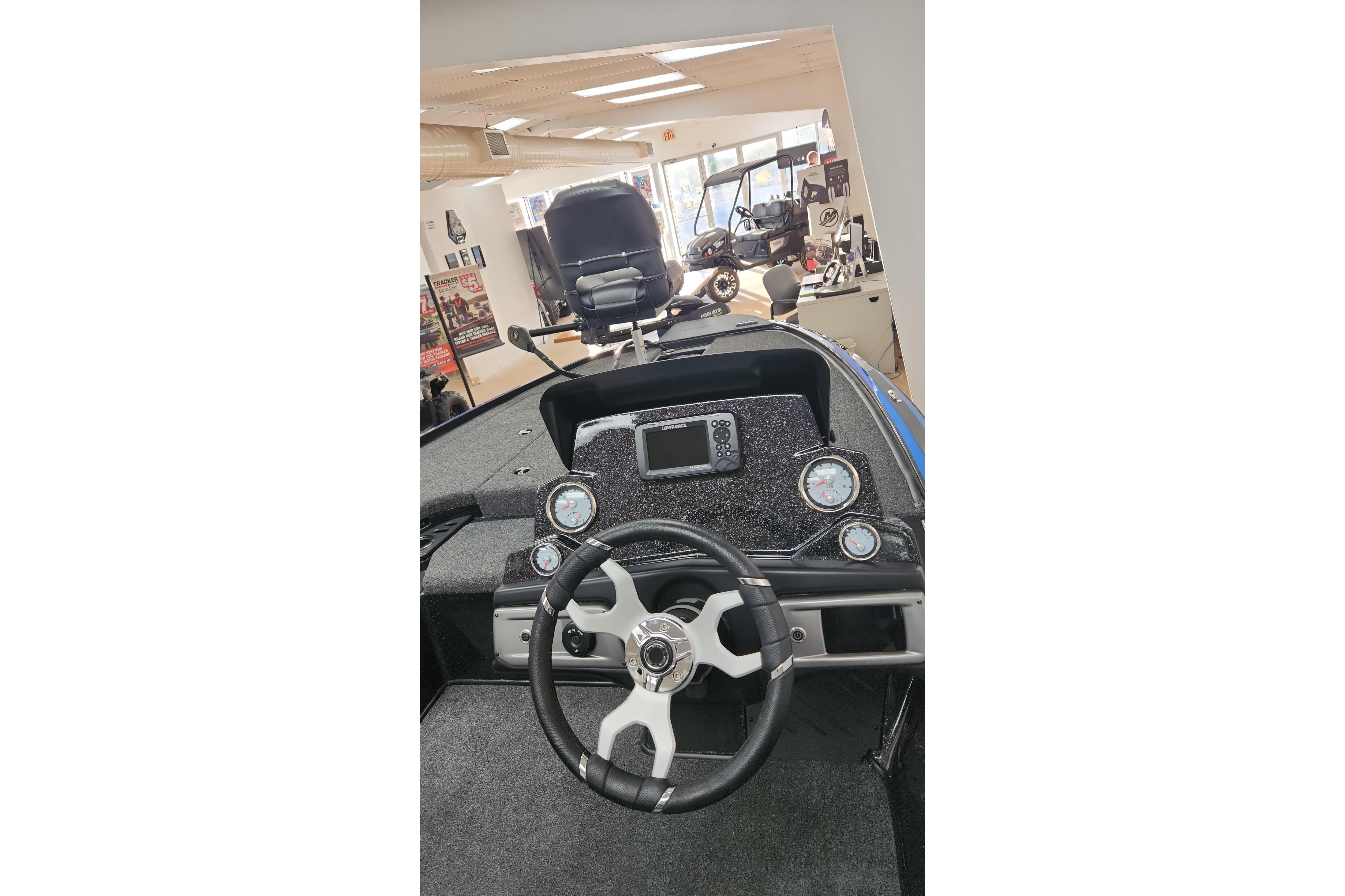 2024 Nitro Z19 boat interior with steering wheel and dashboard controls.