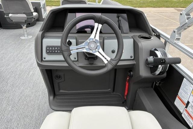 Steering console of 2026 Sun Tracker Fishin' Barge 22 DLX pontoon boat.