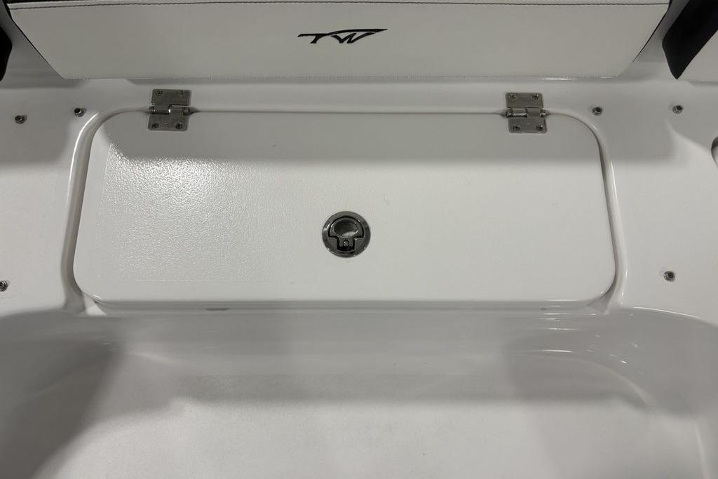 2026 Tidewater 2300 Carolina Bay boat storage compartment with secure latch and hinges.