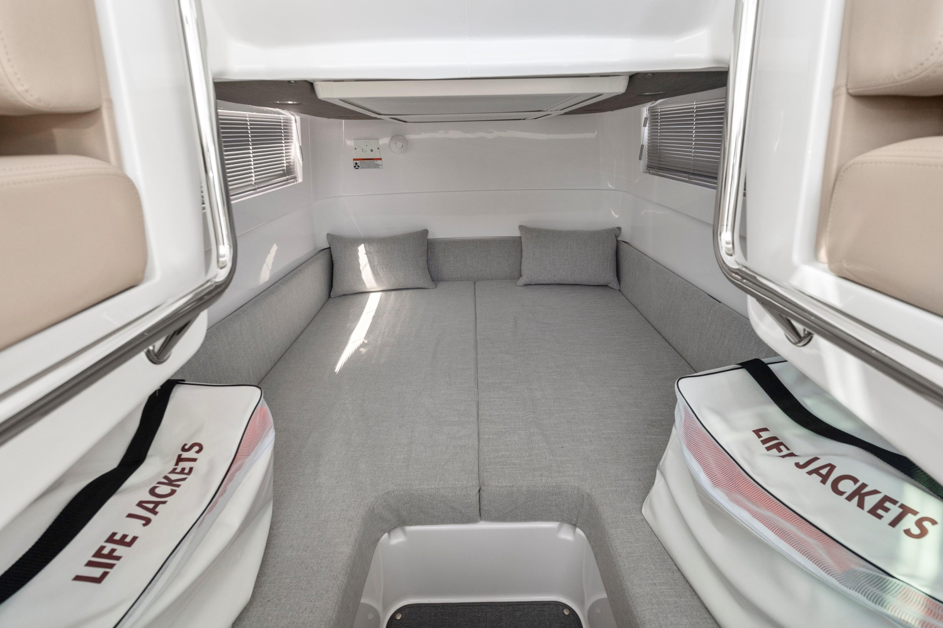 Interior cabin of 2022 Axopar 37 Cross Cabin Brabus Trim with life jackets.