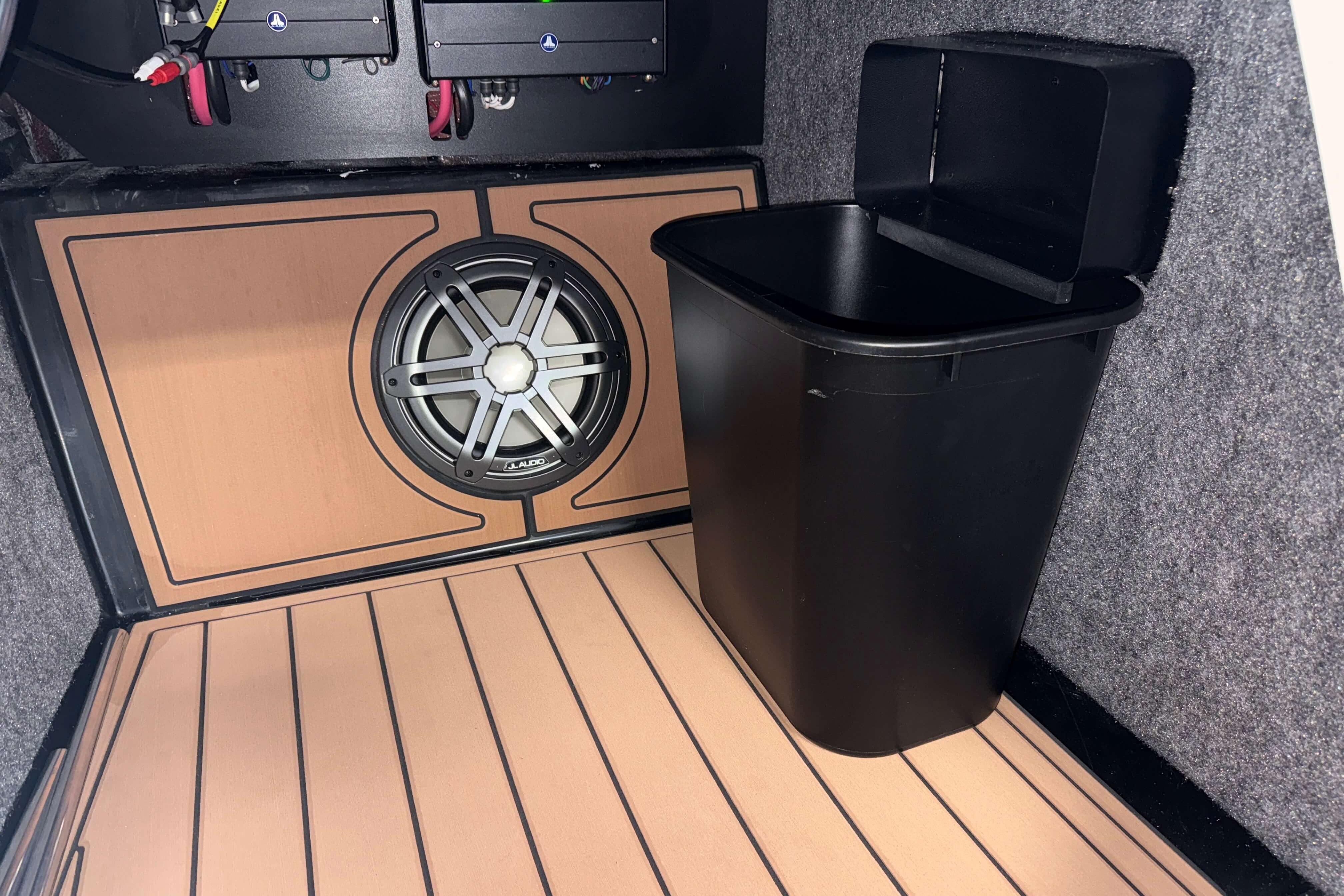 2026 Nautique Super Air Nautique GS22 interior with speaker and storage bin.