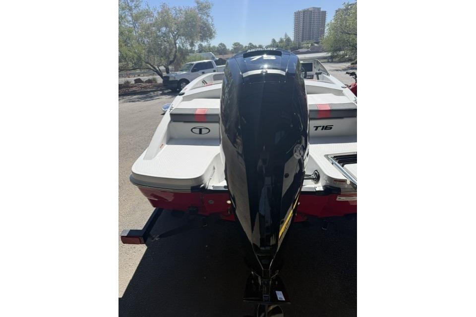 2026 Tahoe T16 boat with powerful outboard motor, parked outdoors.