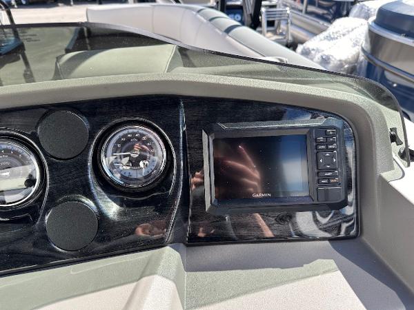 Dashboard of 2025 Tahoe Pontoon 2585 LTZ Entertainer with Garmin display and gauges.