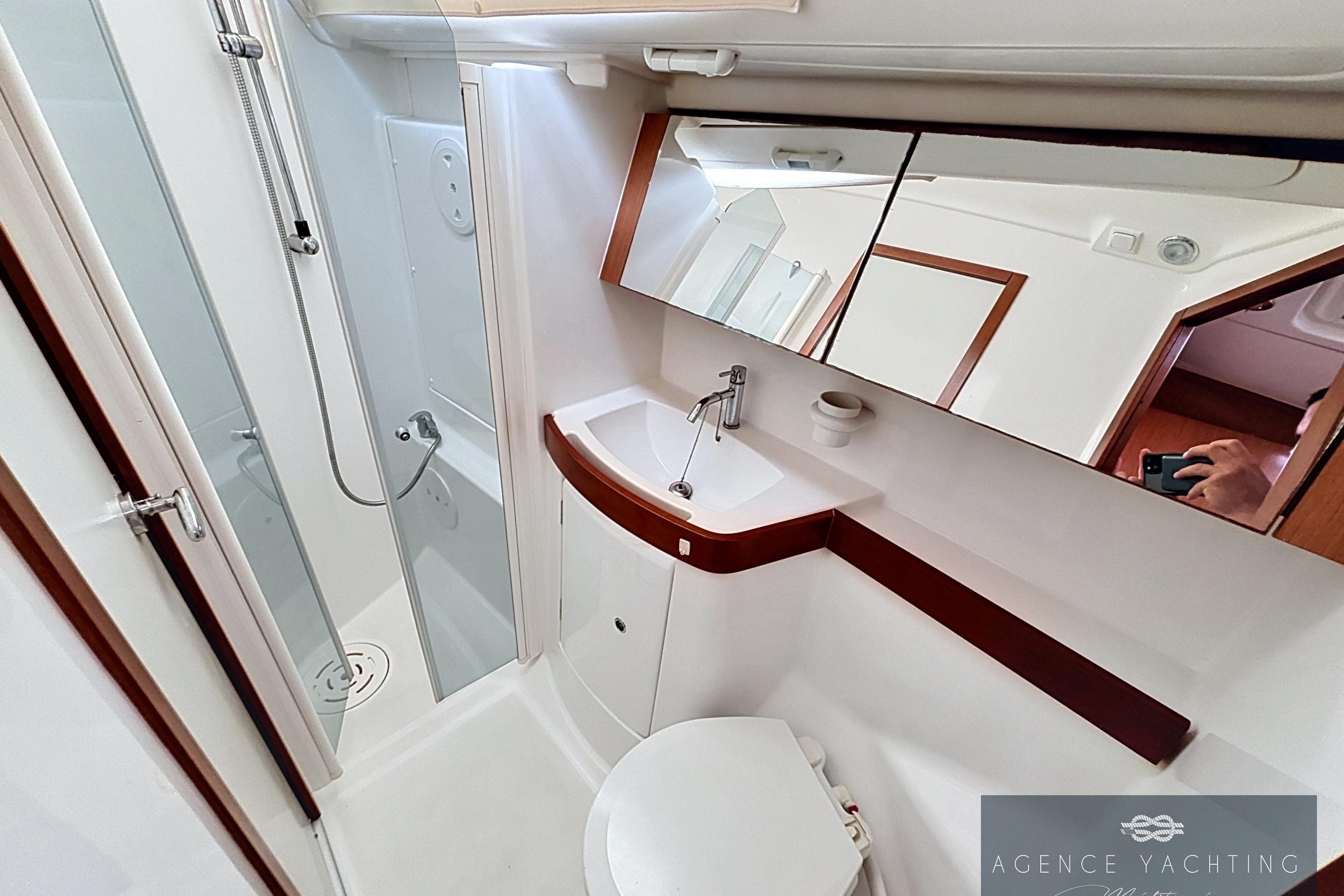 Bathroom interior of 2008 Beneteau Oceanis 40 yacht, featuring modern fixtures and shower.