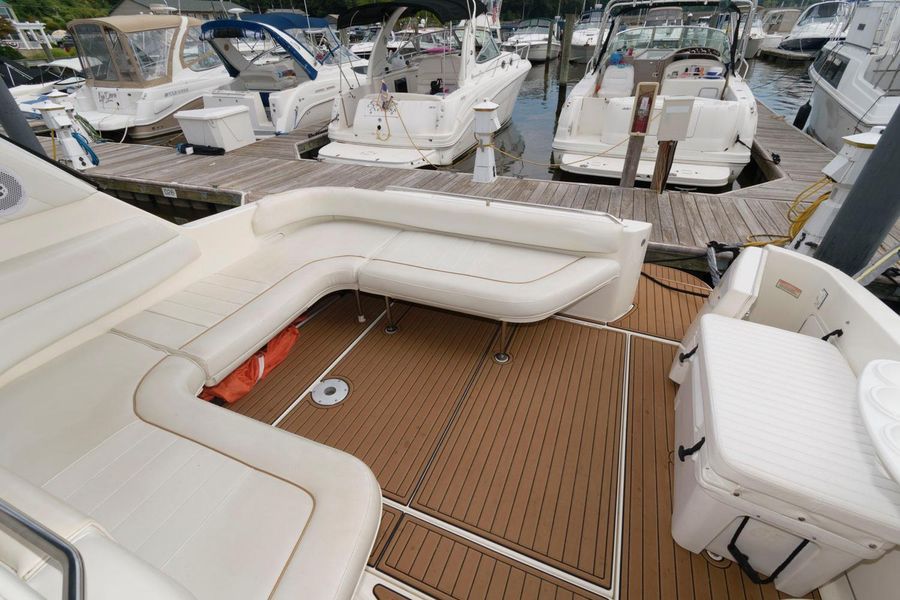 1998 Sea Ray Sundancer 370 with spacious cockpit at the dock.