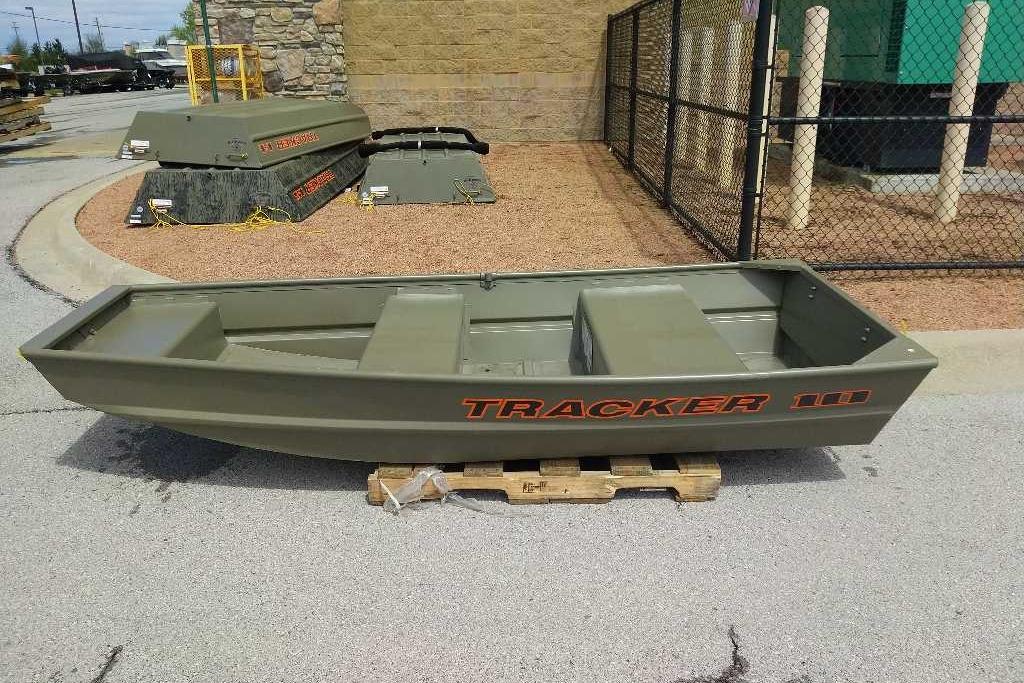 2026 Tracker Grizzly 10 Jon boat displayed outdoors on a wooden pallet.