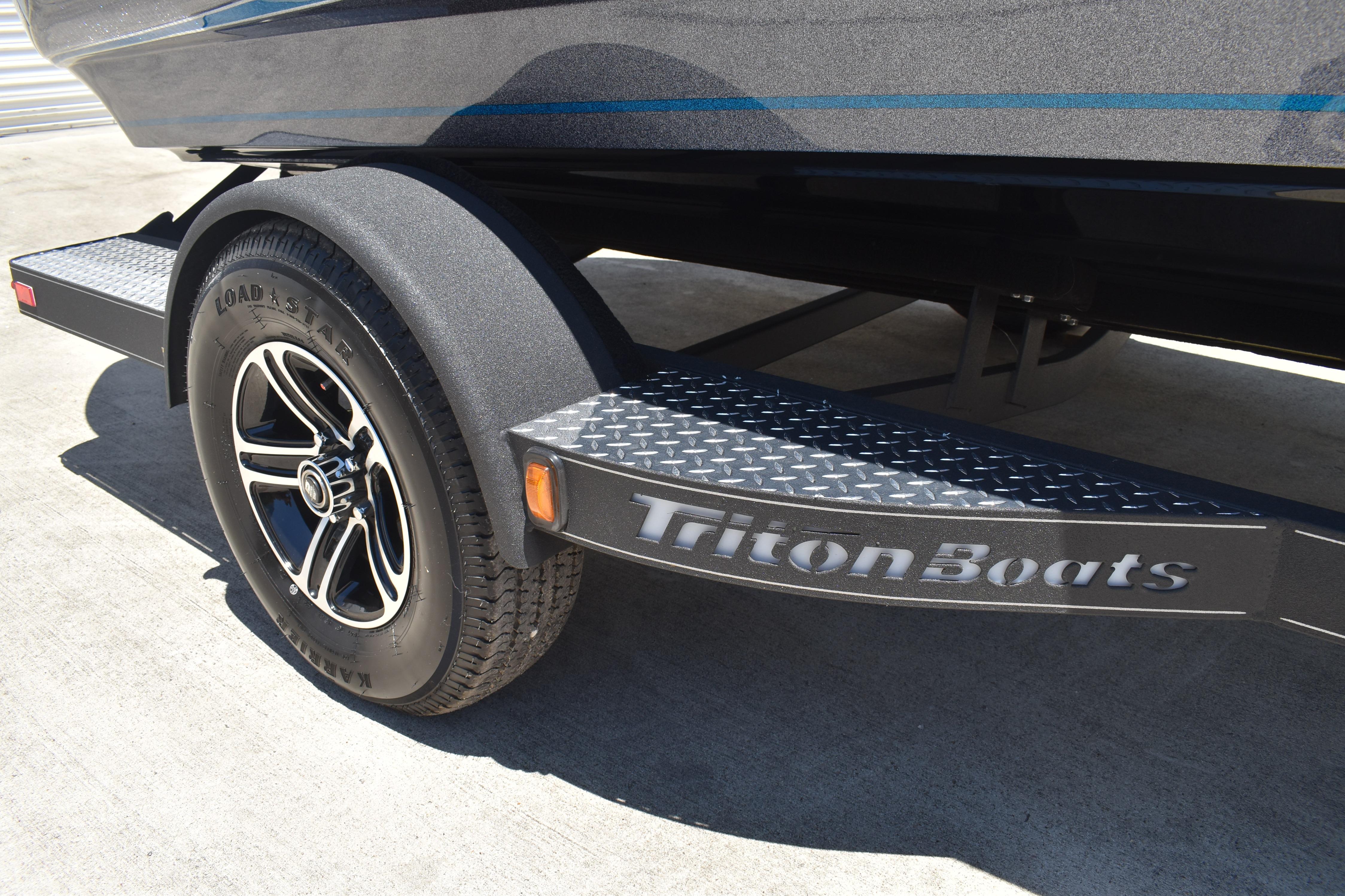 Trailer of 2026 Triton 179 TrX boat with Load Star tire and Triton Boats branding.