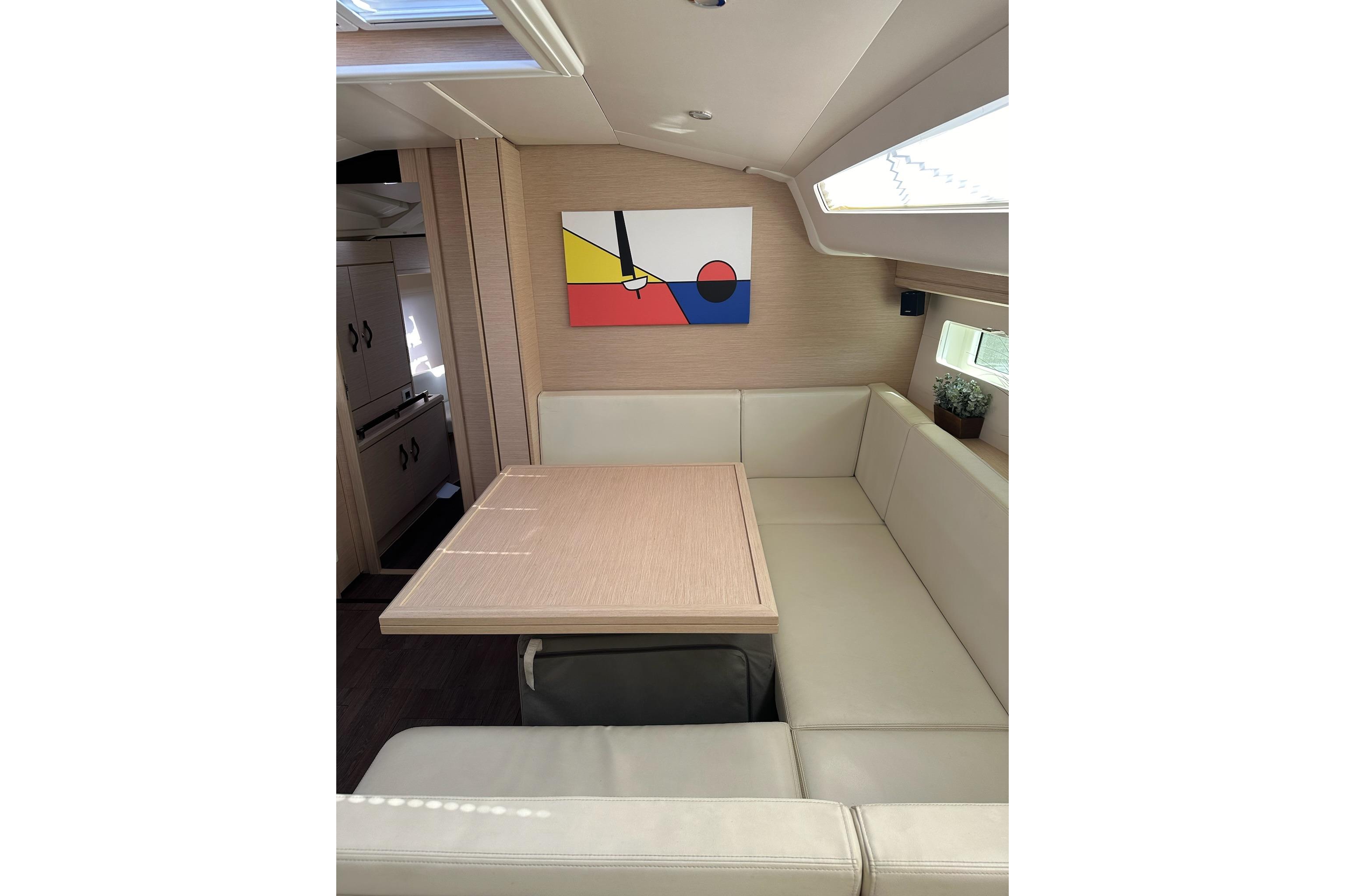 Interior of 2018 Jeanneau 51 yacht with modern decor and comfortable seating.