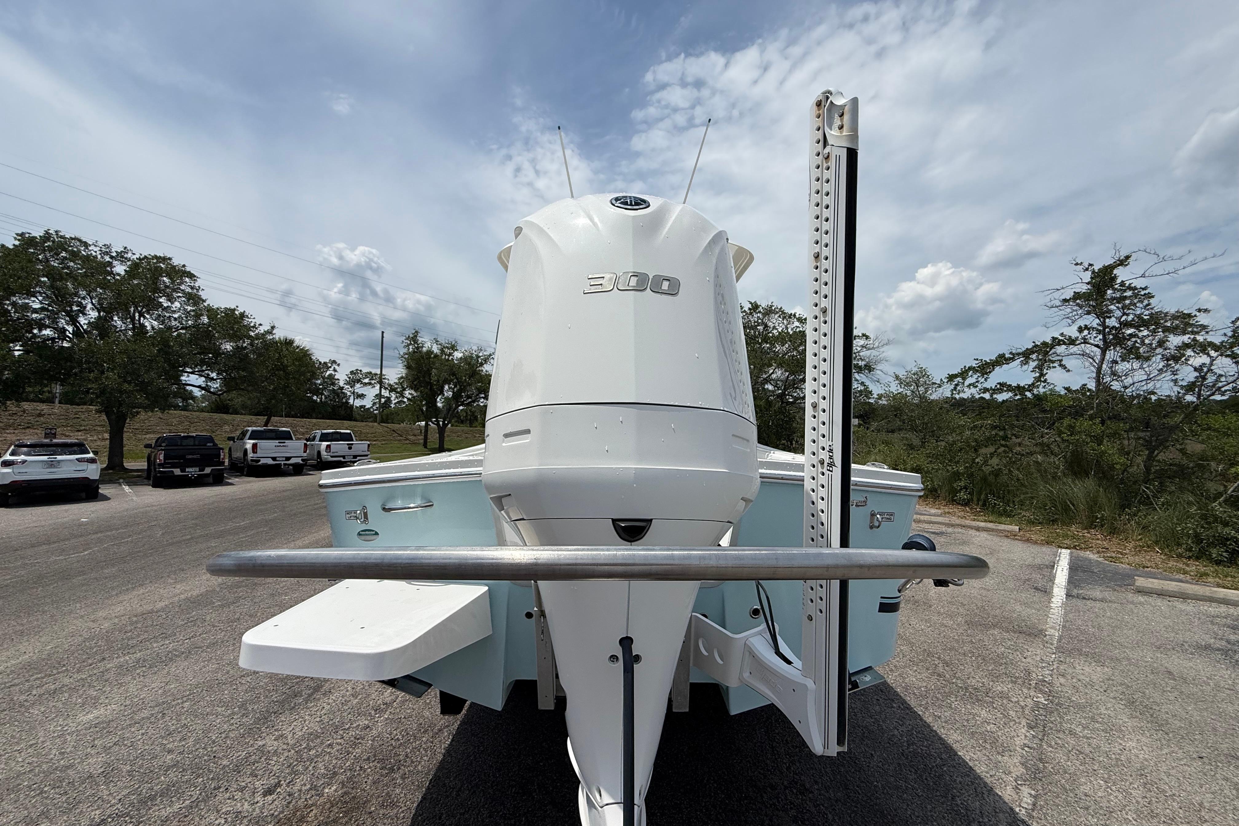 2019 Regulator 26XO boat with powerful 300 horsepower engine, parked outdoors.