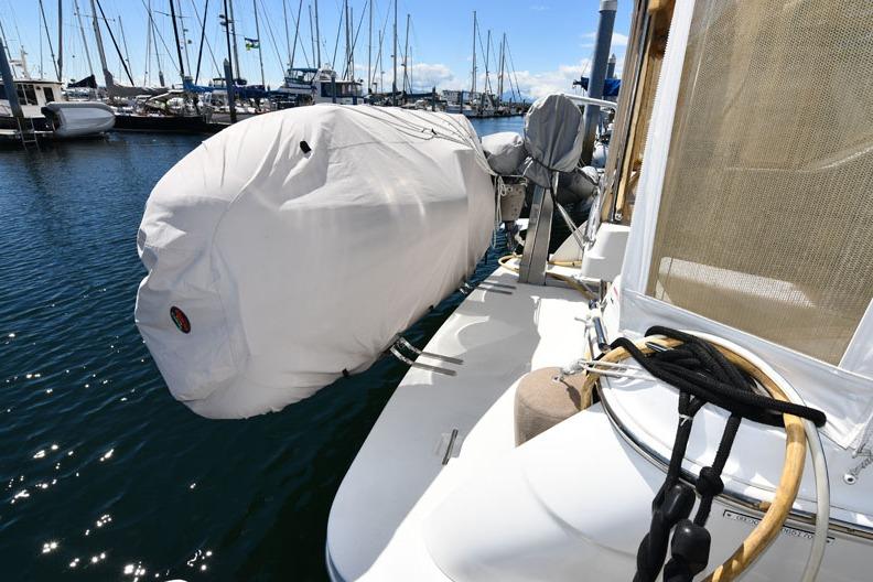 2008 Carver 43 Super Sport yacht docked with covered equipment, marina background.
