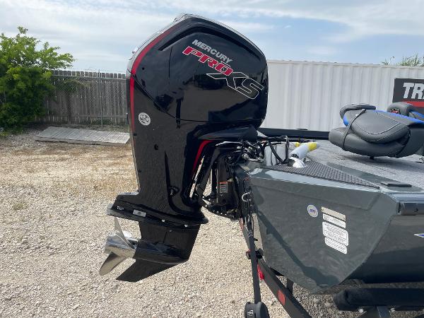 2025 Ranger RT188P boat with Mercury Pro XS outboard motor in a yard.