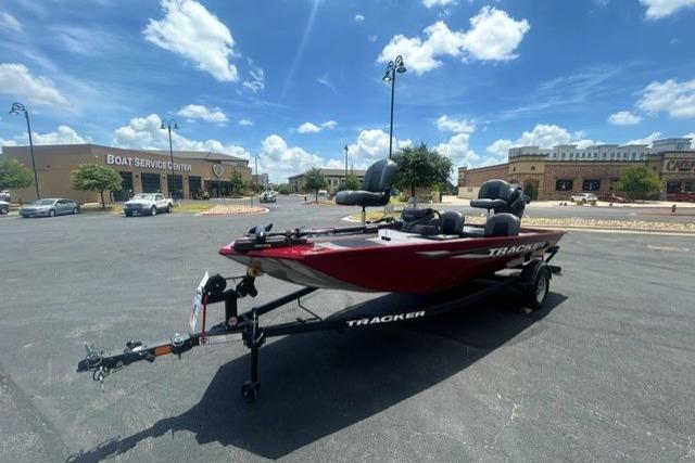 2026 Tracker Pro 170 boat on trailer in parking lot under blue sky.