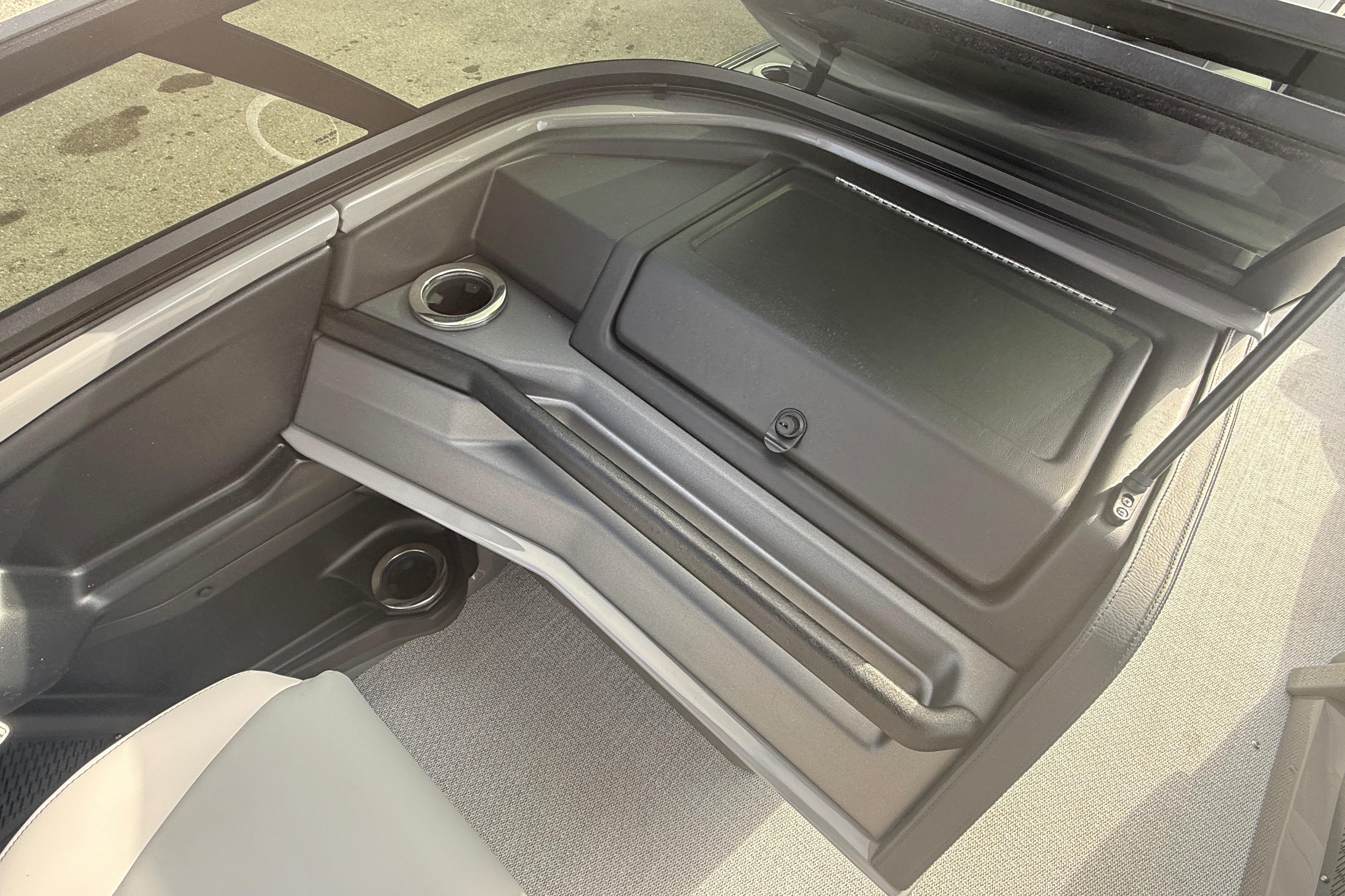 2026 Avalon 2585 Excalibur LTD interior storage compartment with cup holders.