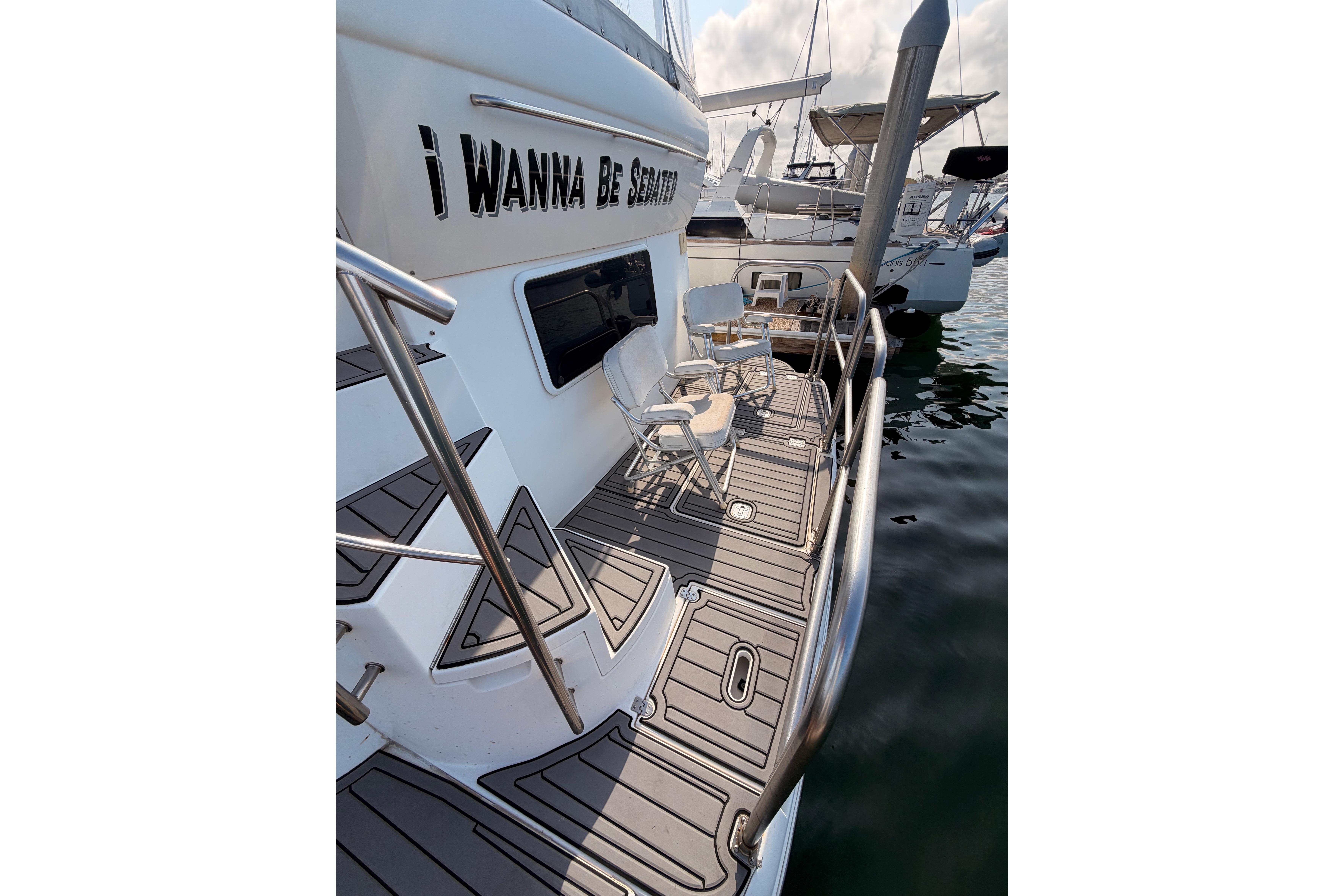 2005 Cruisers Yachts 405 Express Motoryacht docked with seating on deck.