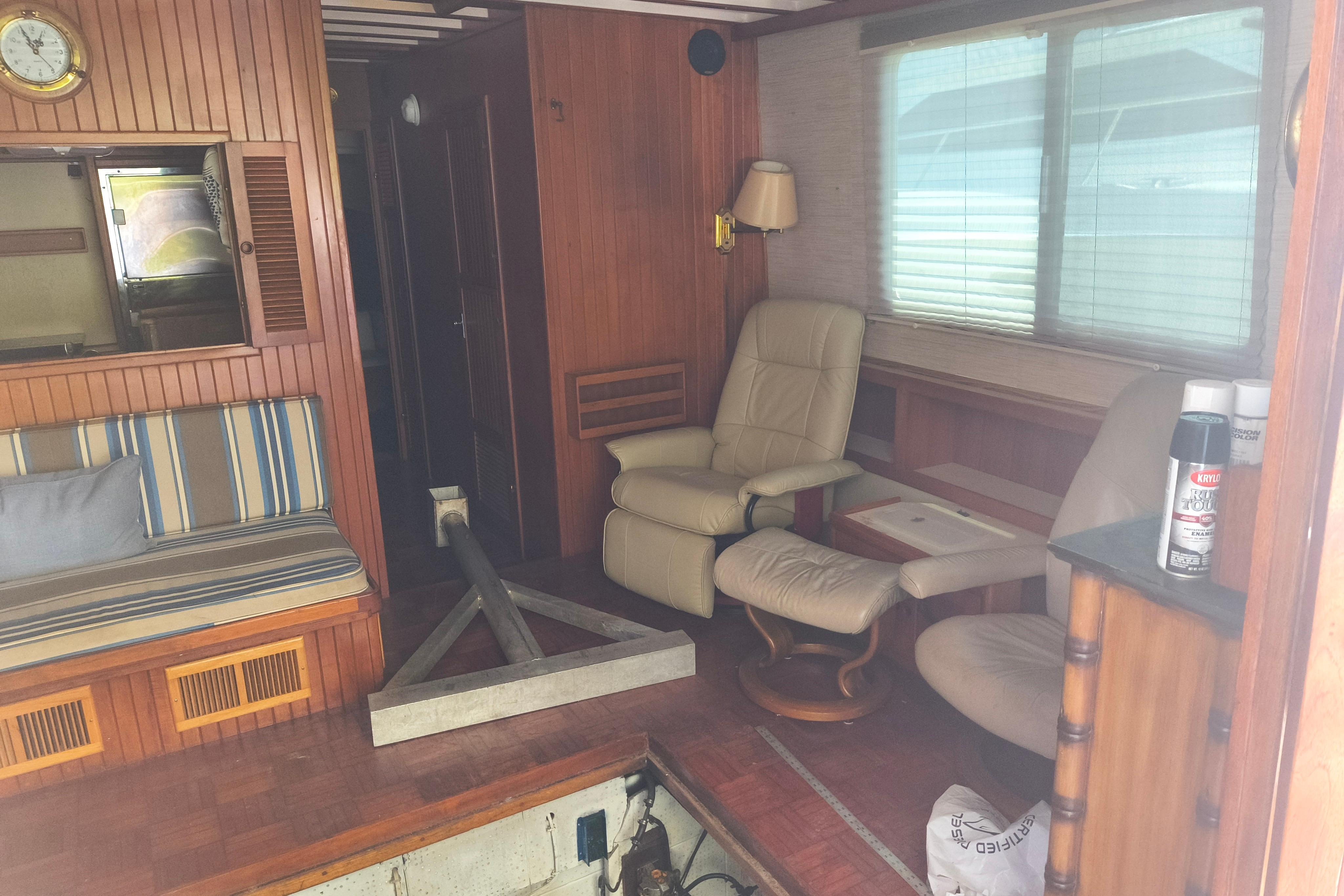 Interior of a 1984 Kadey-Krogen Manatee boat with wood paneling and seating.