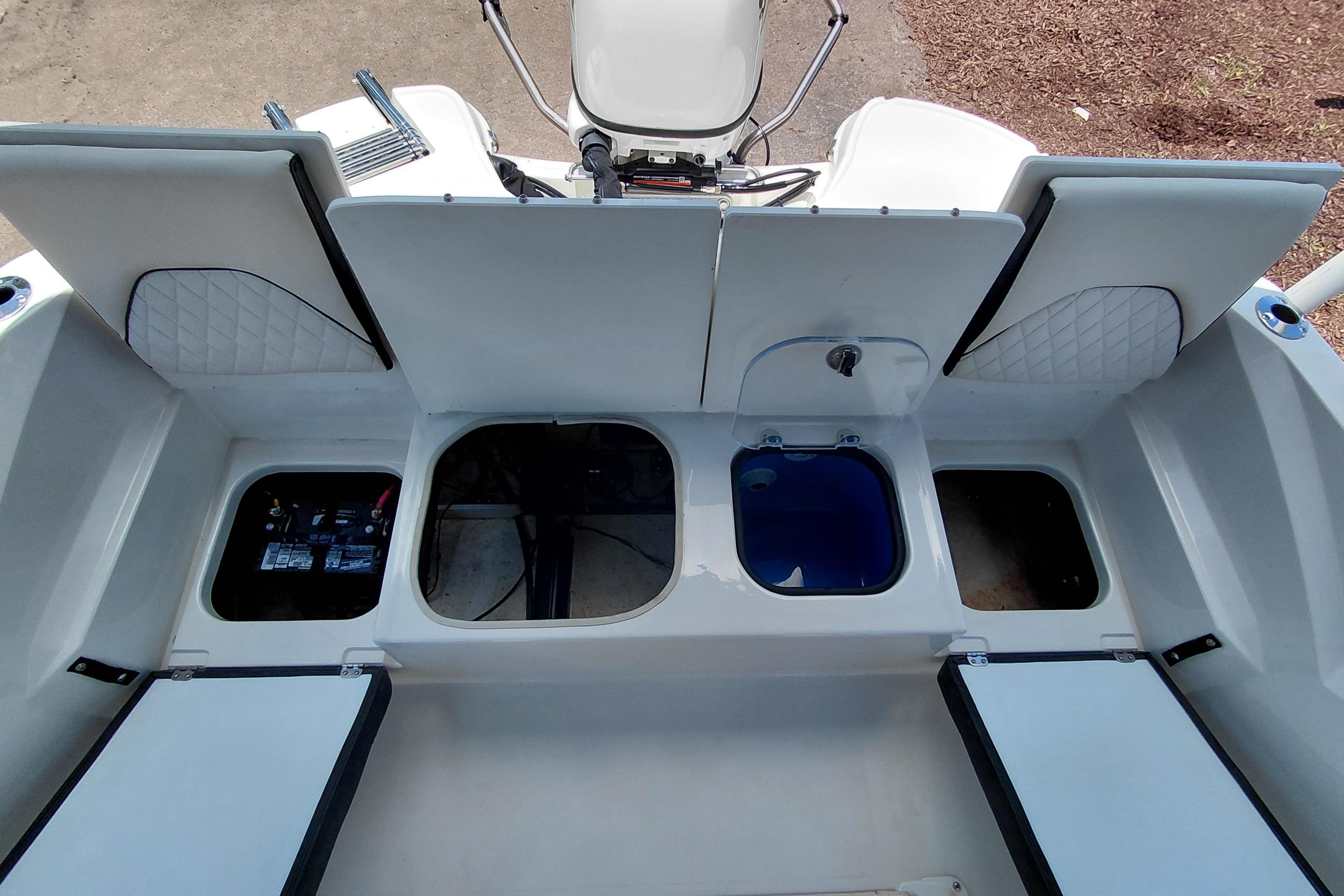 2023 Stingray 206 CC boat interior with open storage compartments and seating.