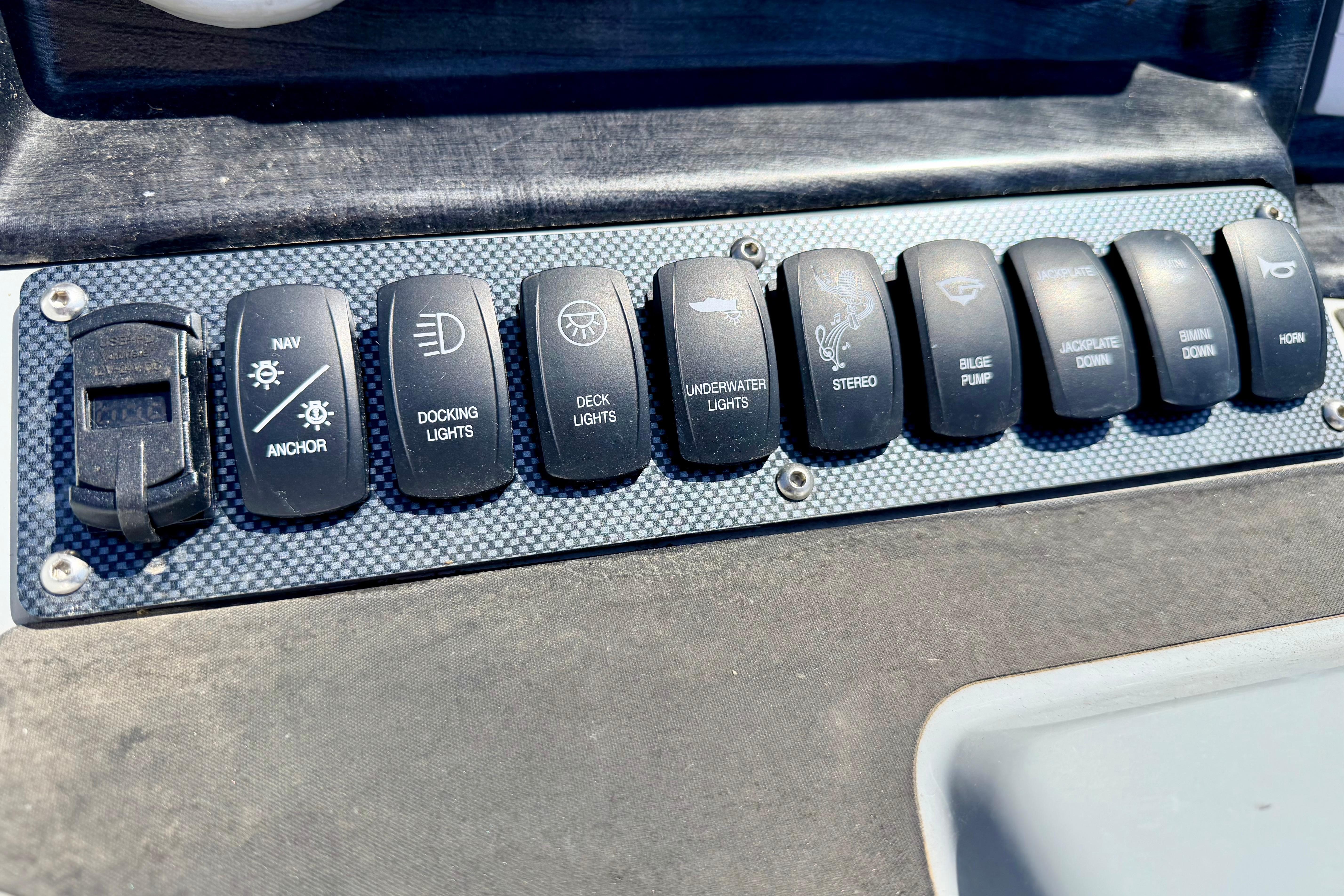 Control panel of a 2019 Crestliner 240 Rally DX CW boat with labeled switches.