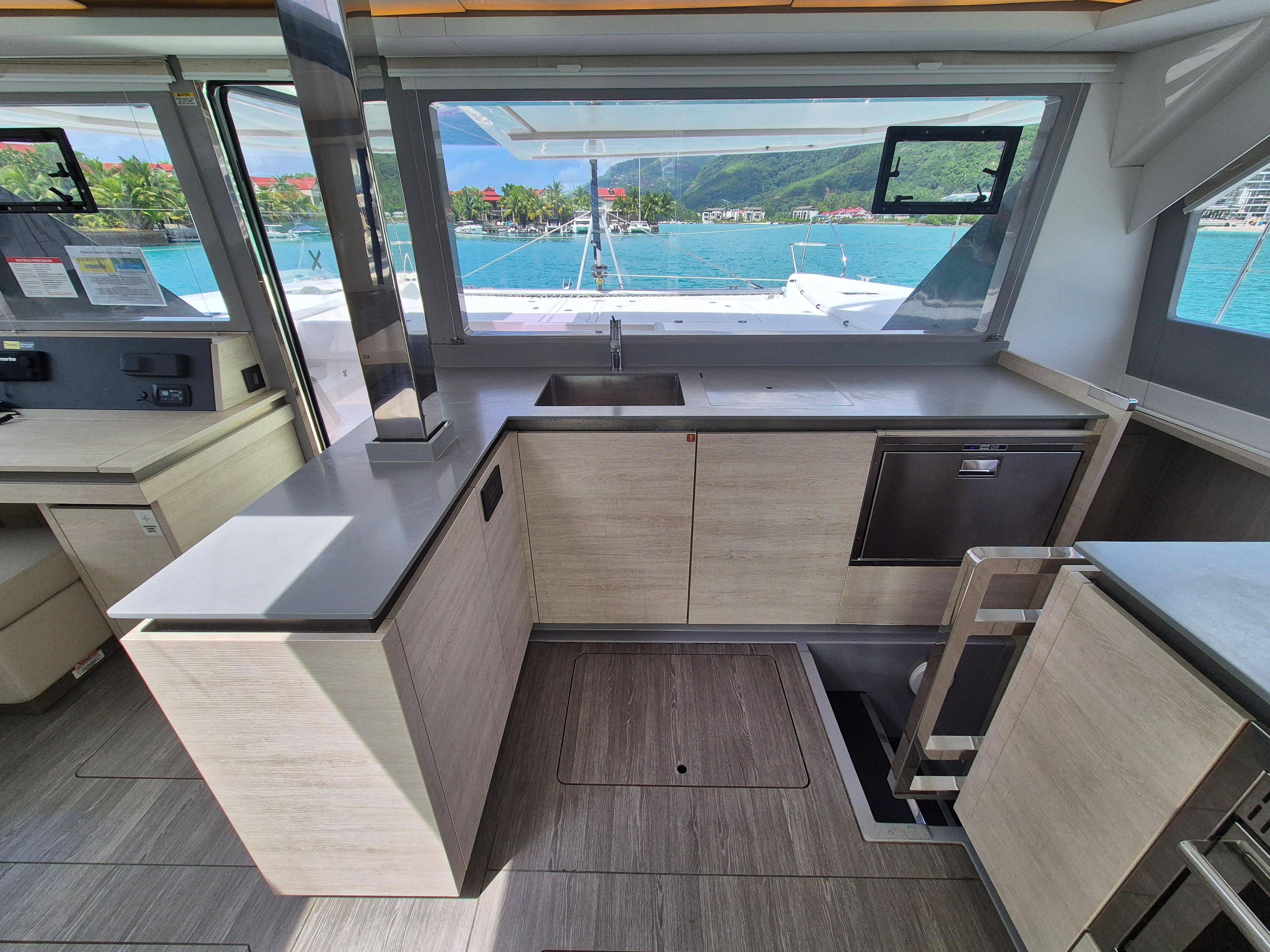 Modern kitchen interior on a 2020 Leopard 50 yacht with ocean view.