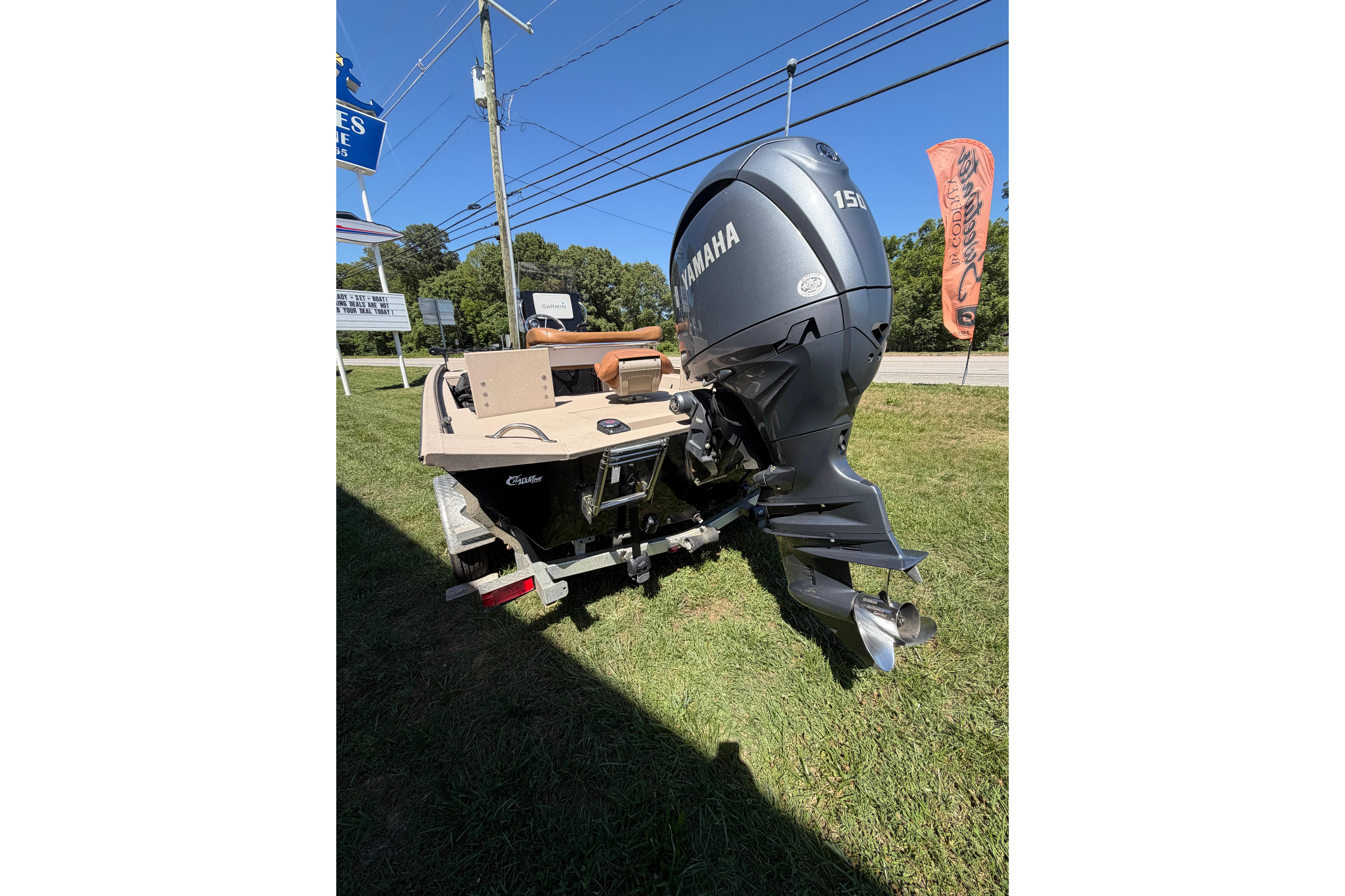 2024 Avid 20 Rogue CC boat with Yamaha 150 engine on display outdoors.