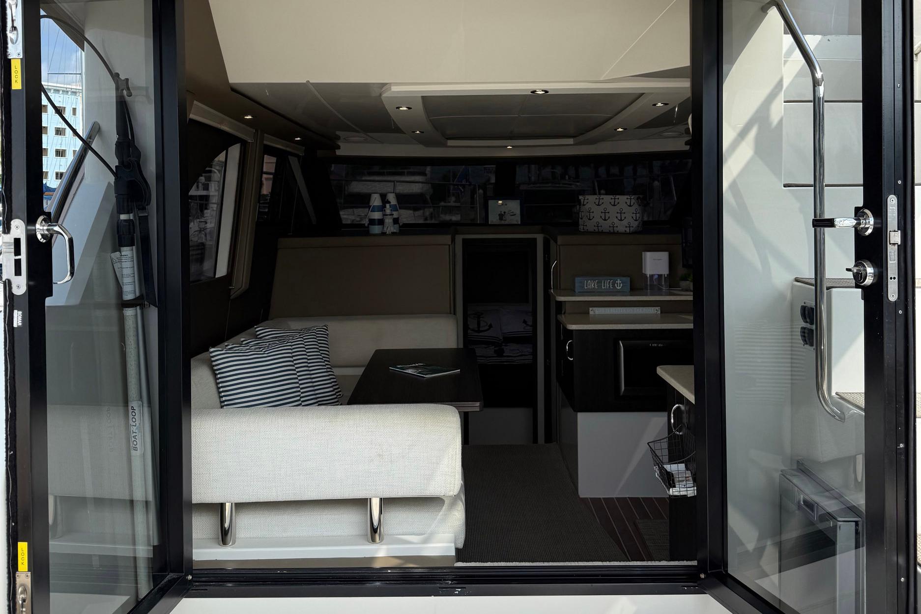 Interior view of 2013 Carver C34 yacht, featuring modern seating and decor.