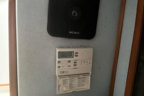 Sony speaker and control panel inside 1989 Sea Ray 300 Sundancer boat.