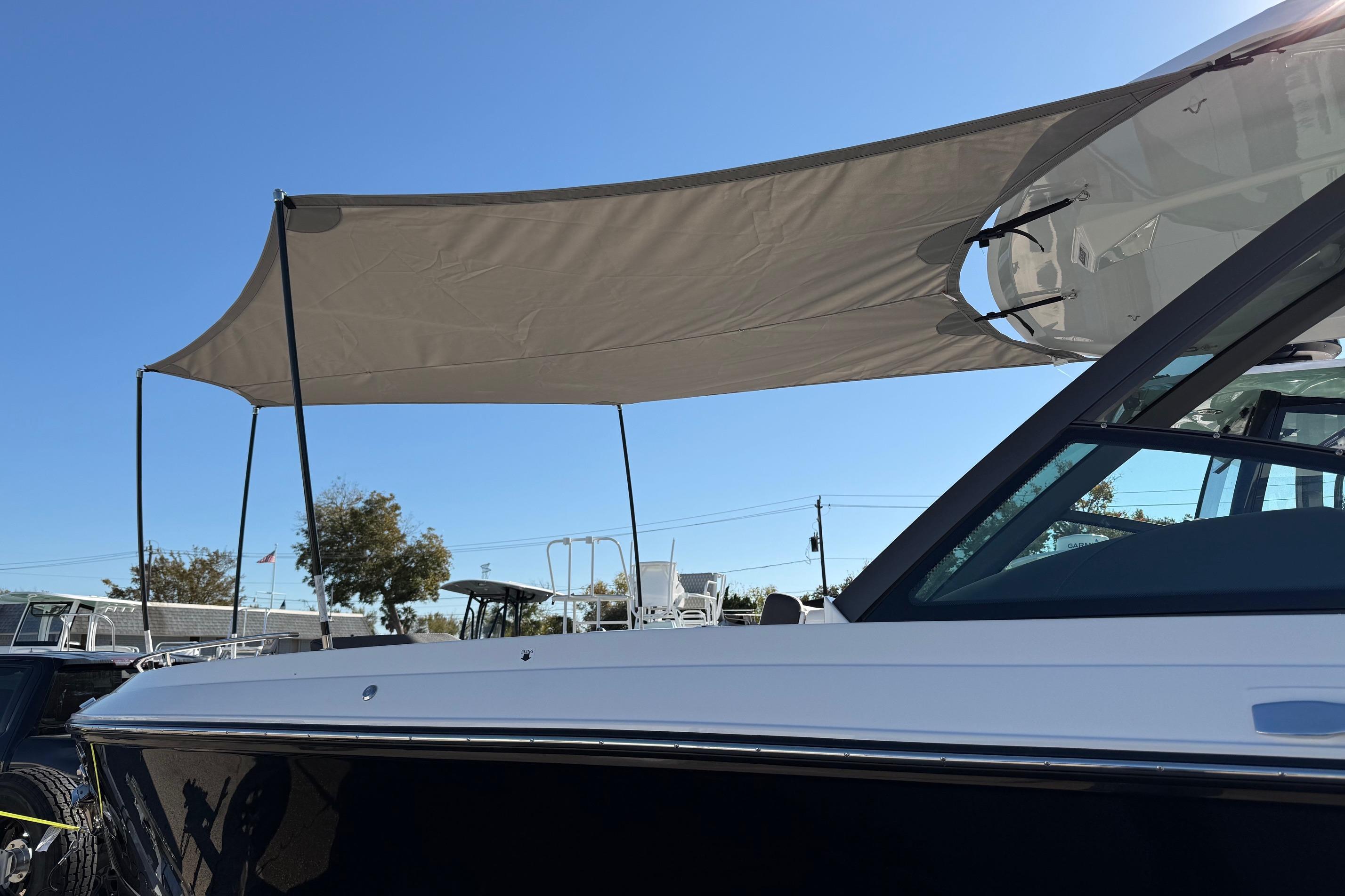 2026 Monterey Elite 27 OB with sunshade outdoors.