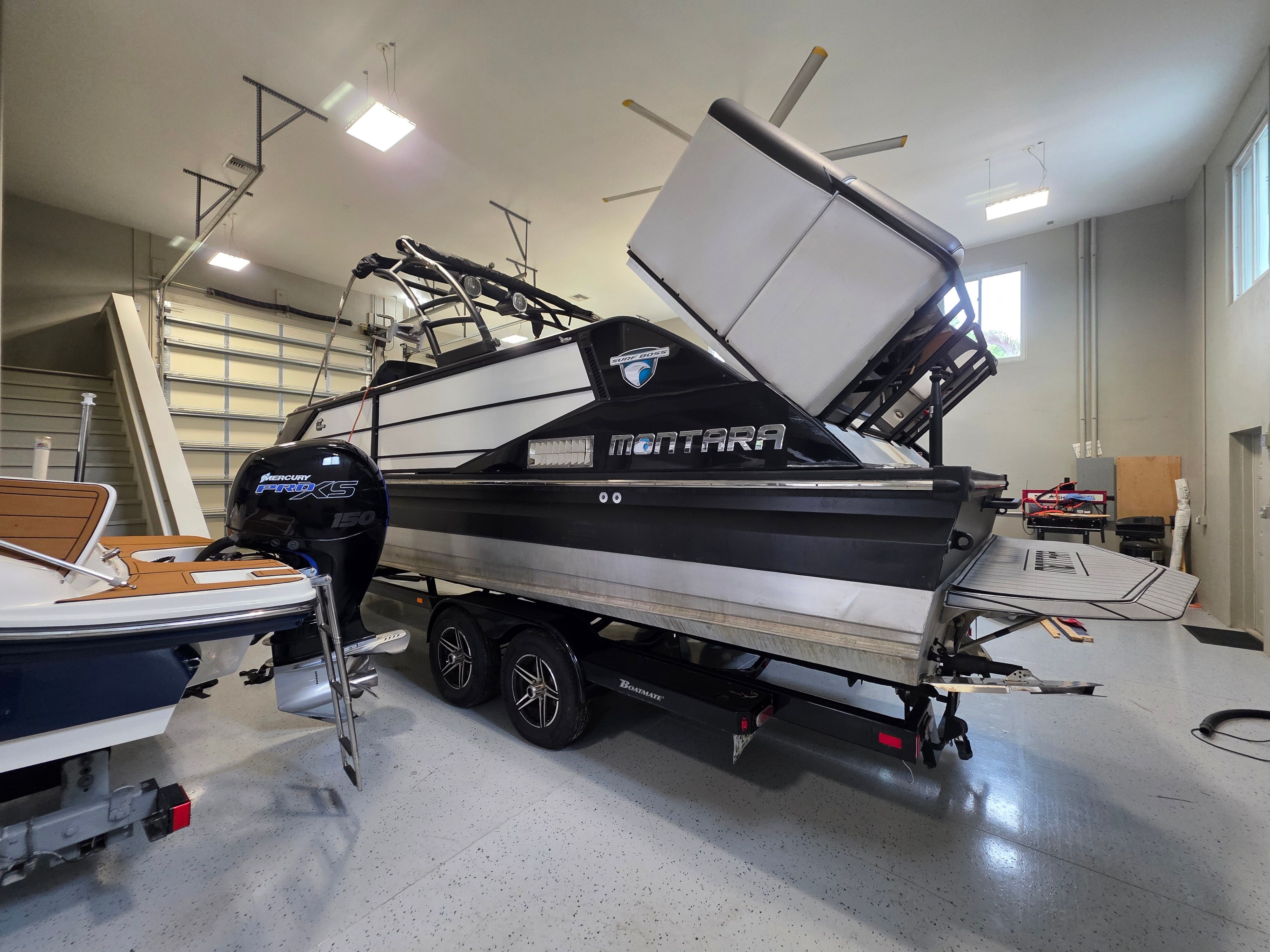 2021 Montara SURF BOSS 25 boat in a garage.
