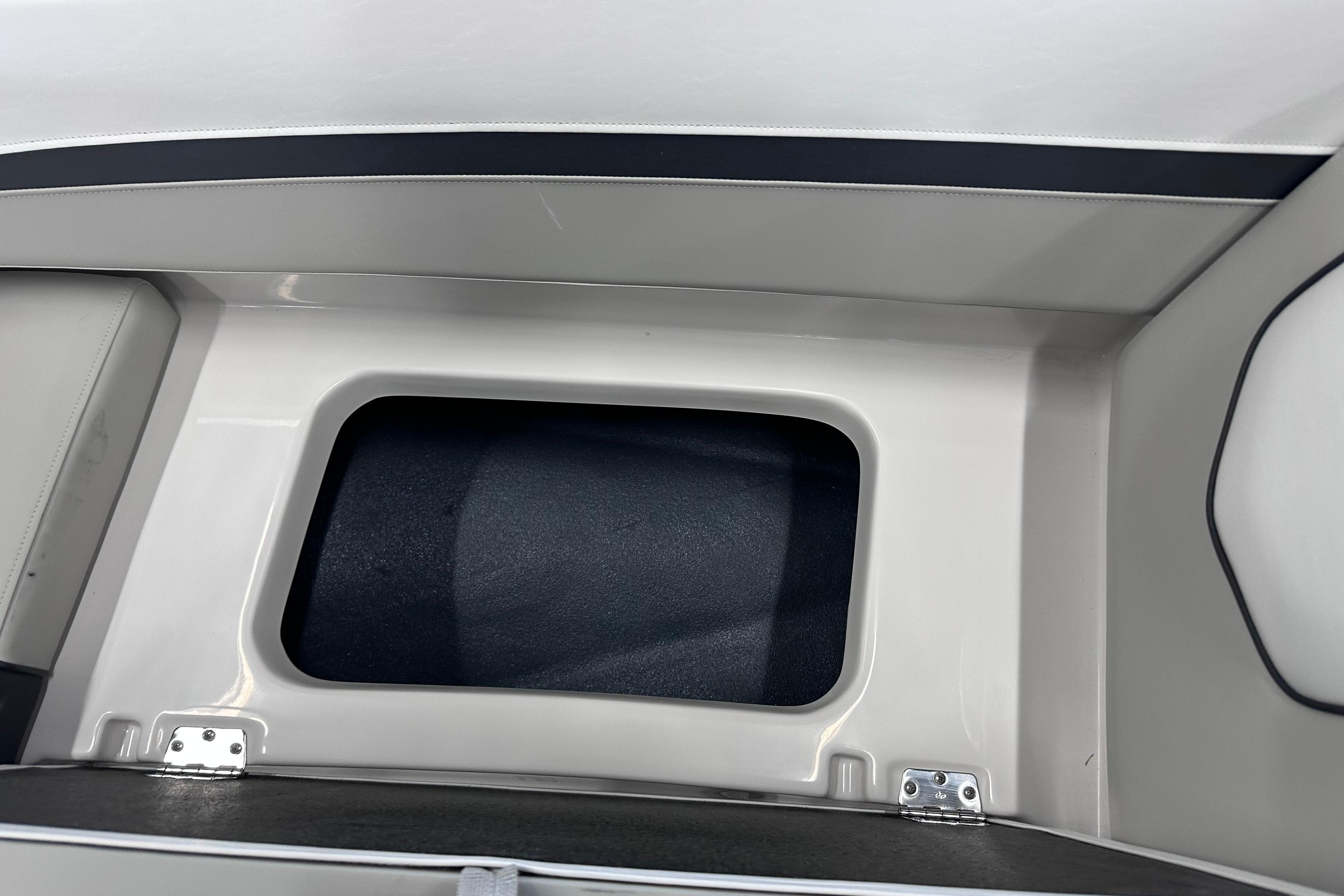 2026 Starcraft SVX 191 OB boat storage compartment, featuring sleek white interior design.