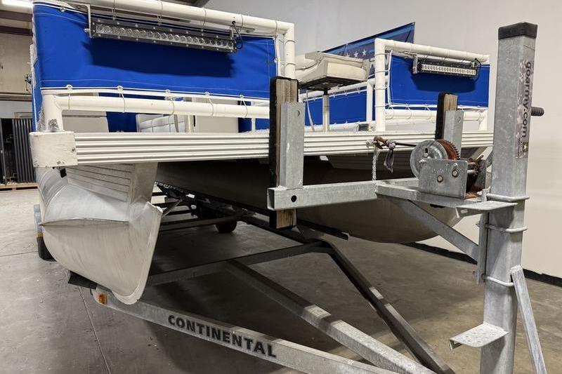 1993 Monark Sun Caster 240 CR 4 Point pontoon boat on a Continental trailer.