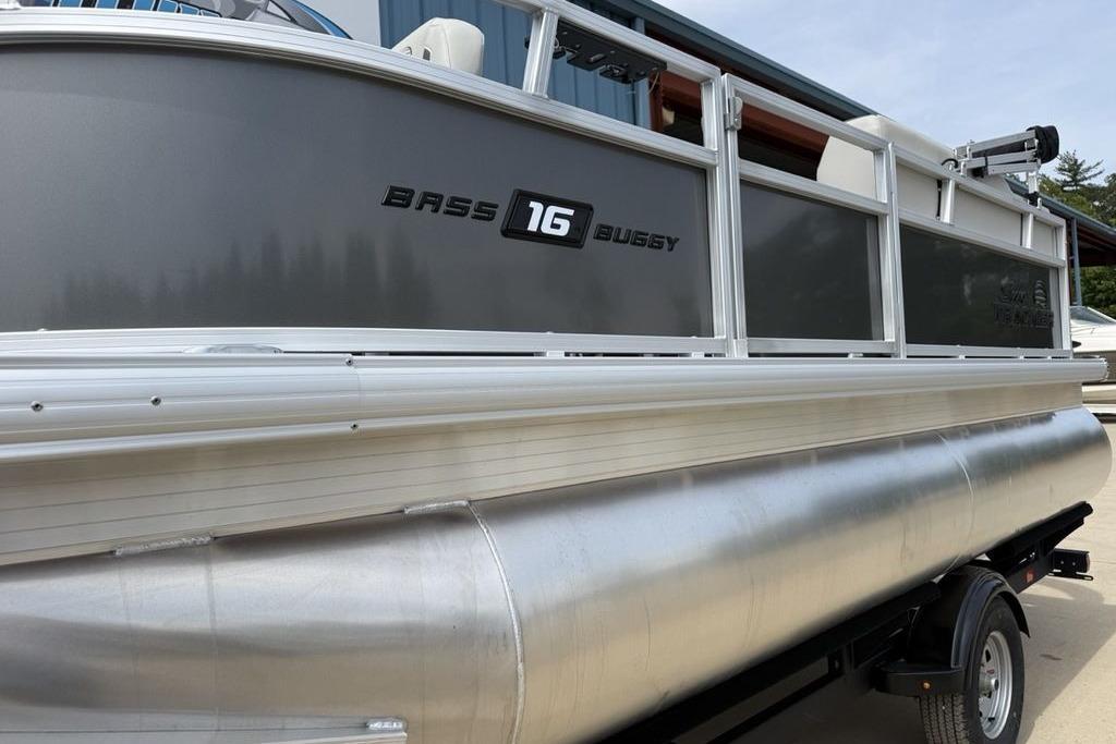 2026 Sun Tracker Bass Buggy 16 XL Select pontoon boat on trailer.