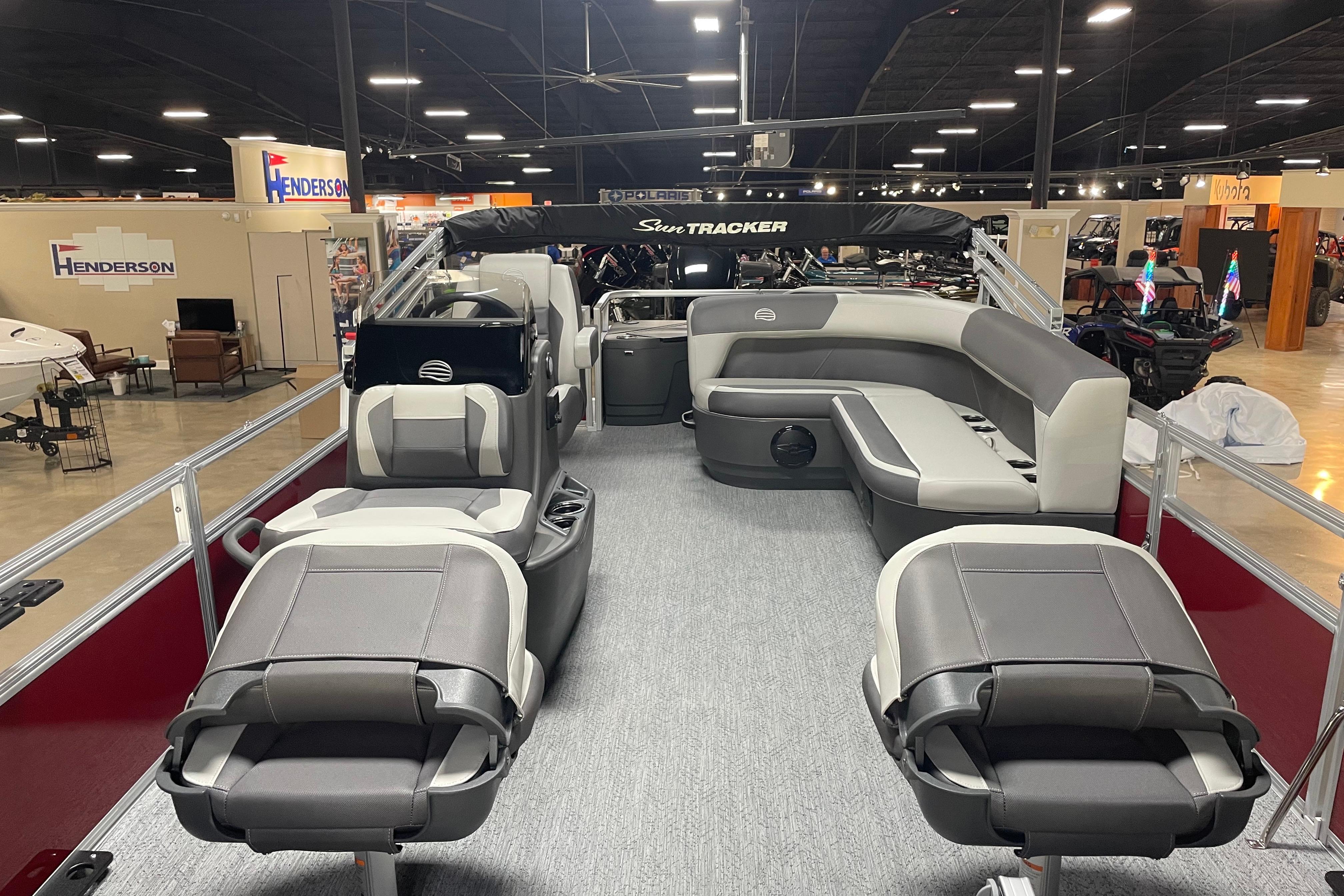 2026 Sun Tracker Bass Buggy 18 DLX pontoon boat interior with seating and helm.