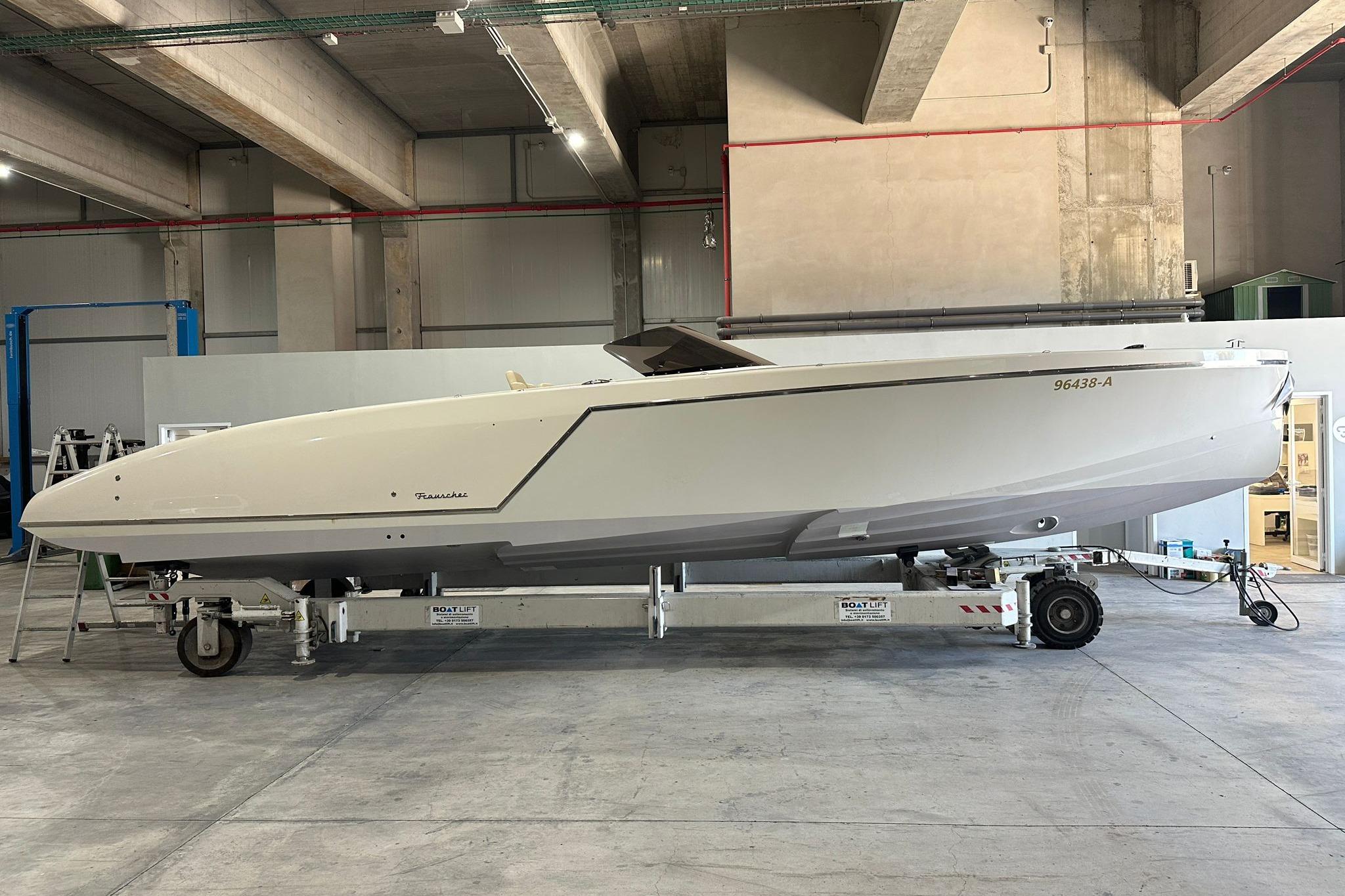 2019 Frauscher 1017 GT boat on trailer in industrial setting.