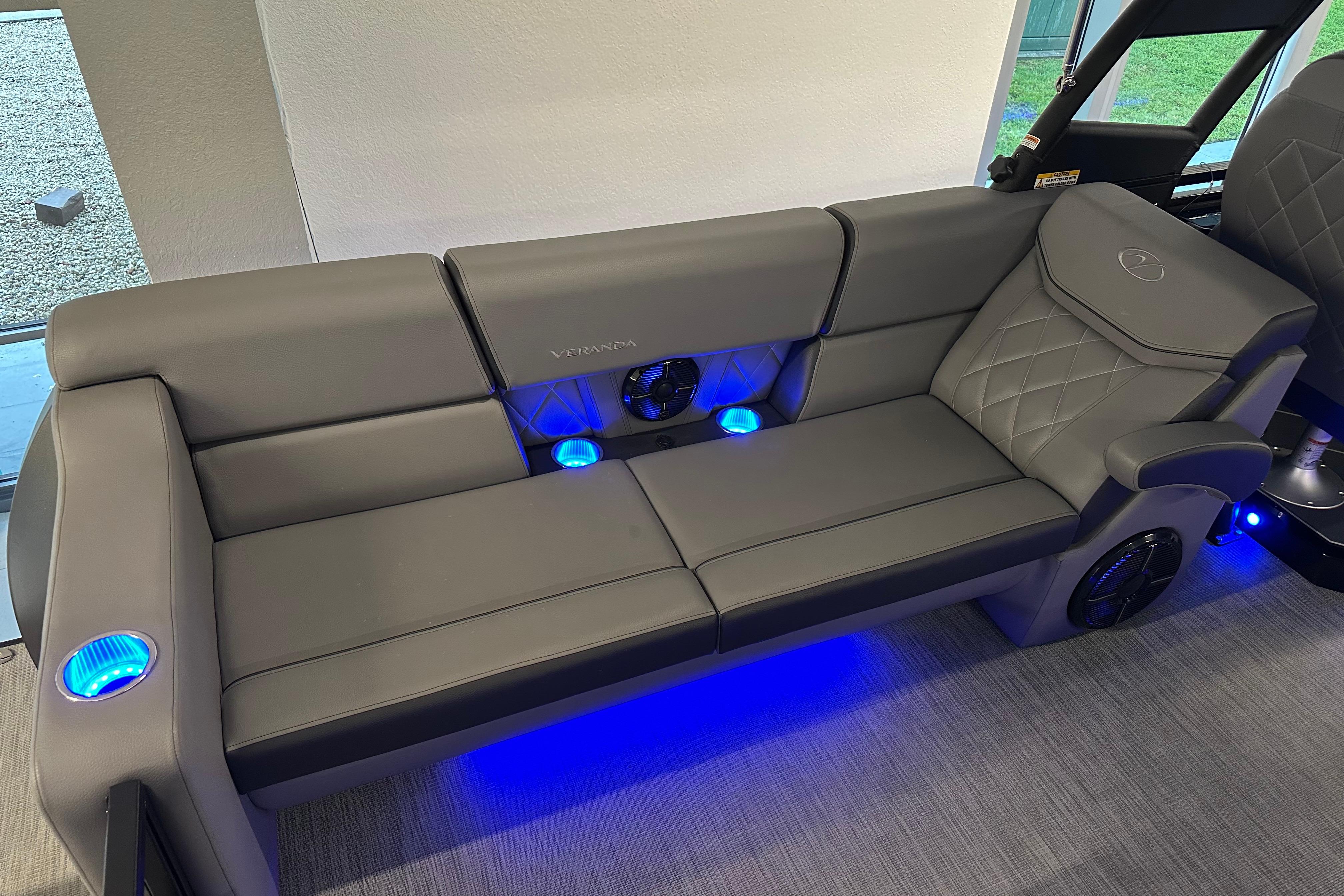 Luxurious seating in the 2025 Veranda VX 27 DCRC with ambient blue lighting.