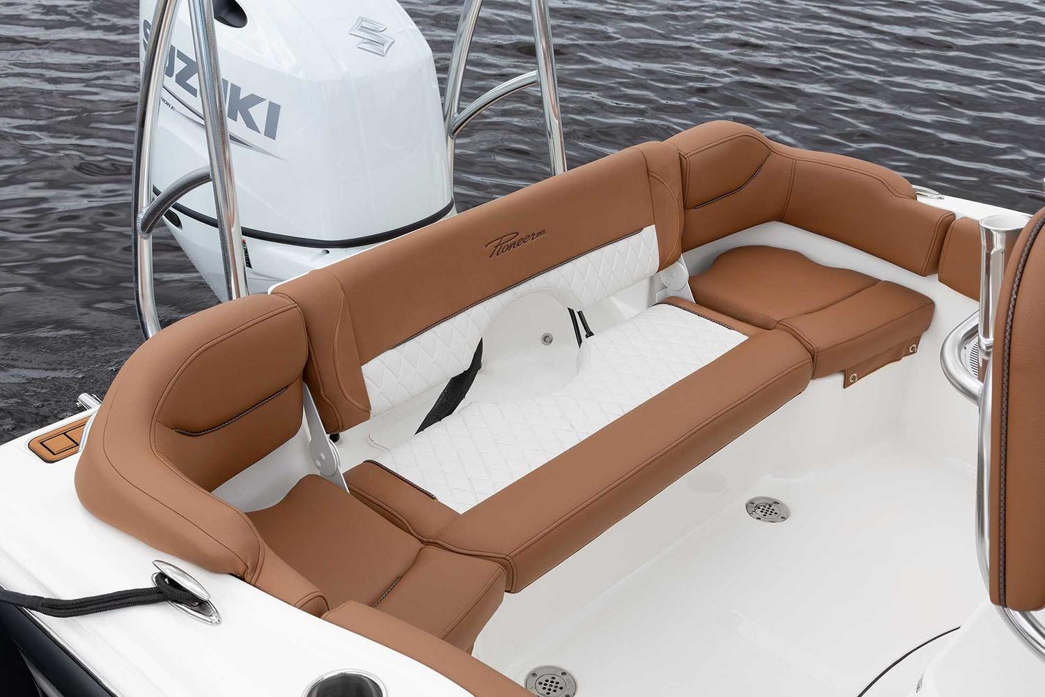 Manufacturer Provided Image: 2025 Pioneer 202 Islander boat interior with brown and white seating, Suzuki engine visible.