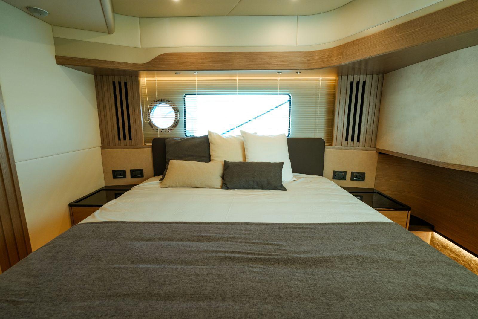 Luxurious bedroom interior of 2024 Absolute NAVETTA 52 yacht with modern design.