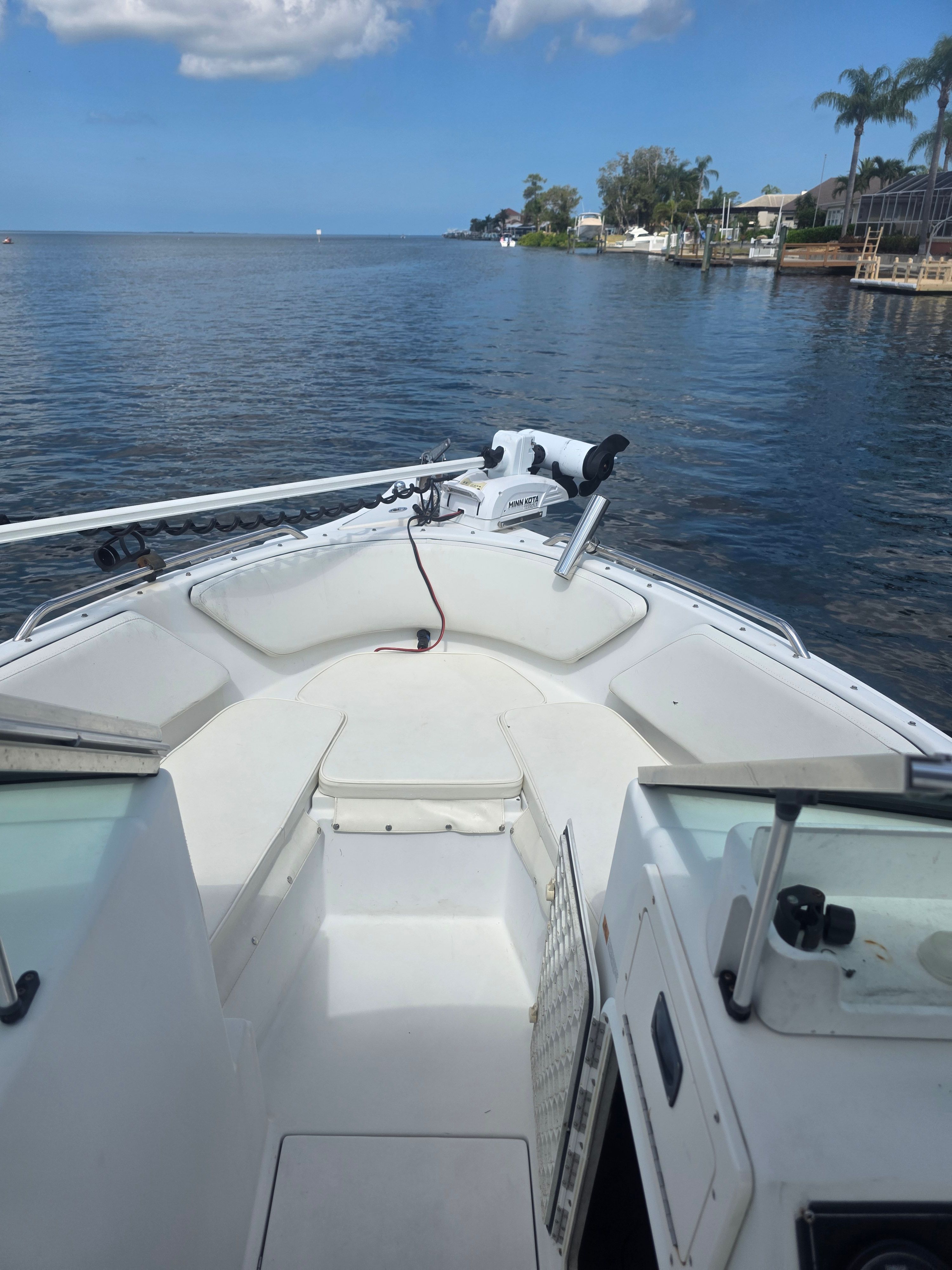 The boat is a 2002 Seaswirl Striper 2101 DC, on calm water with a blue sky.