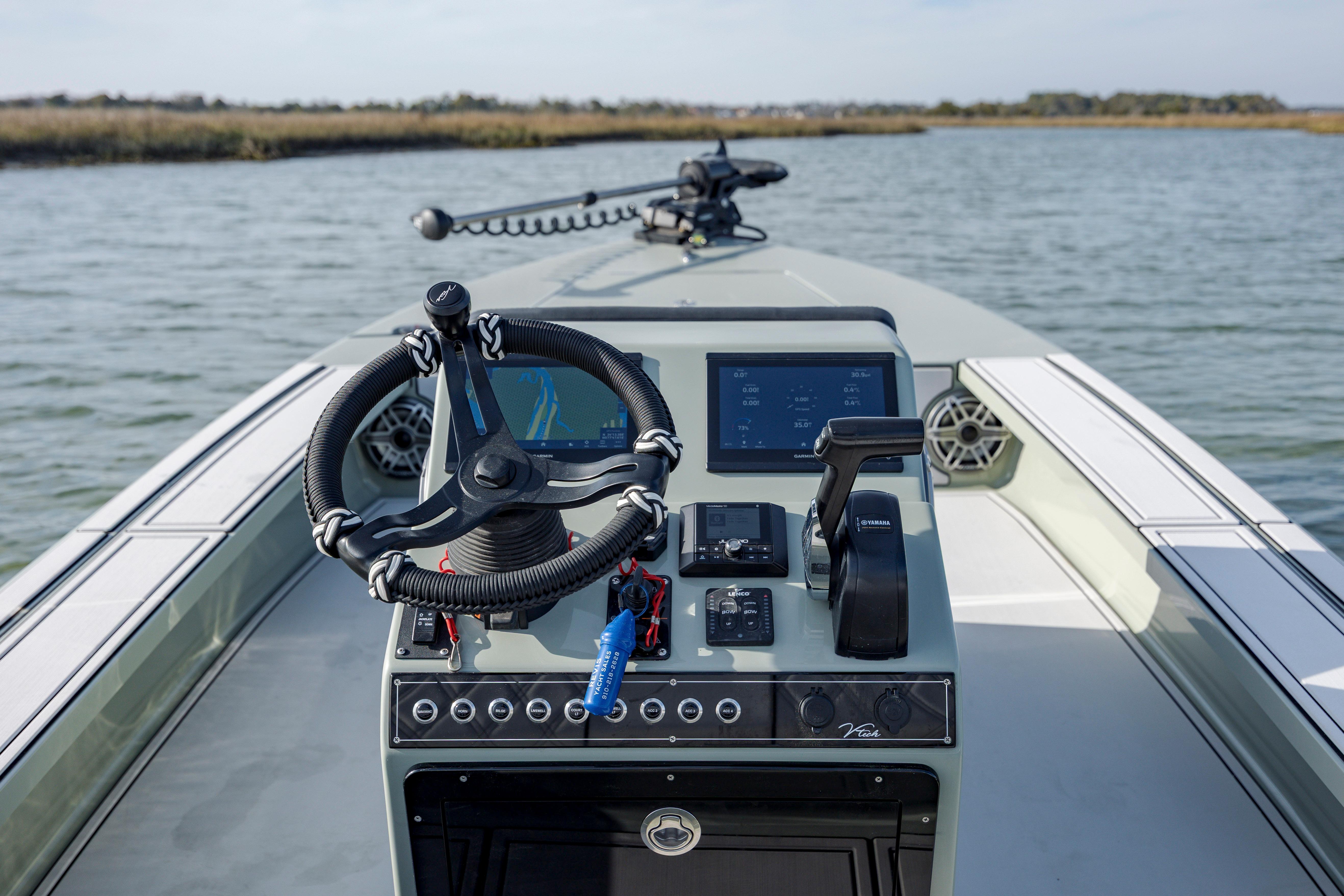 Steering console of 2025 Vtech 18 boat with advanced navigation system.