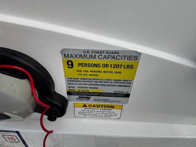 U.S. Coast Guard capacity label on 2022 Hurricane SunDeck Sport 185 OB, 9 persons or 1207 lbs.