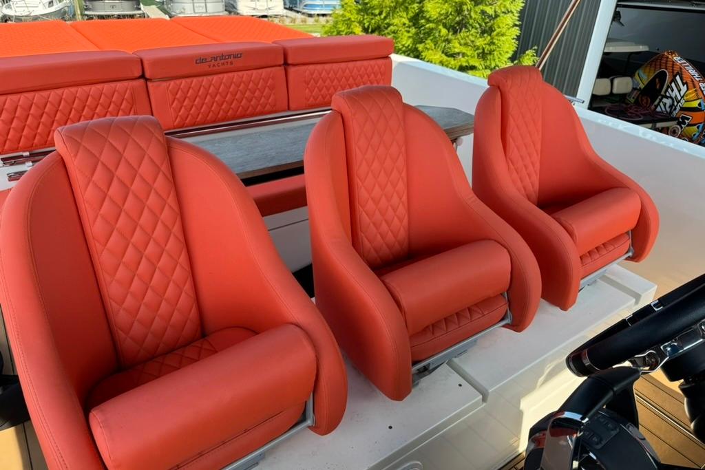 Red quilted seats on 2020 De Antonio Yachts D28, luxury boat interior.