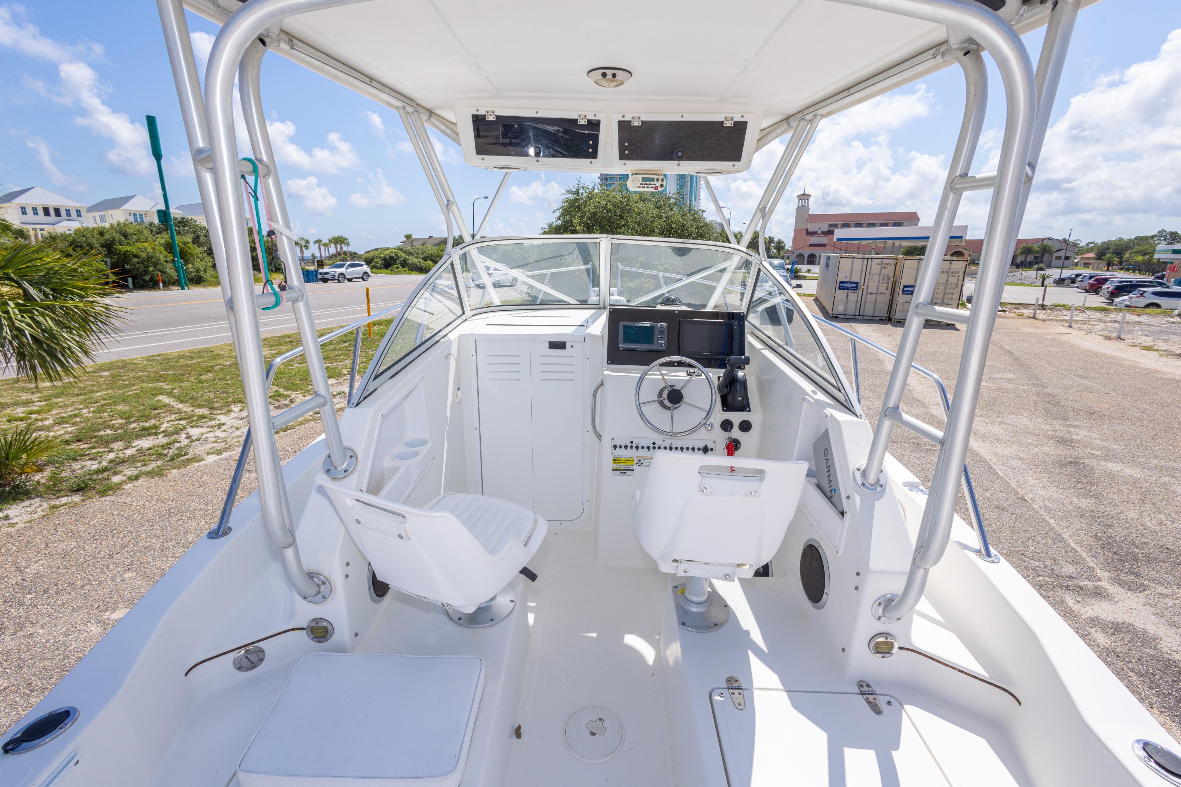 2007 Sea Boss 235 Walkaround boat interior with steering console and seating.