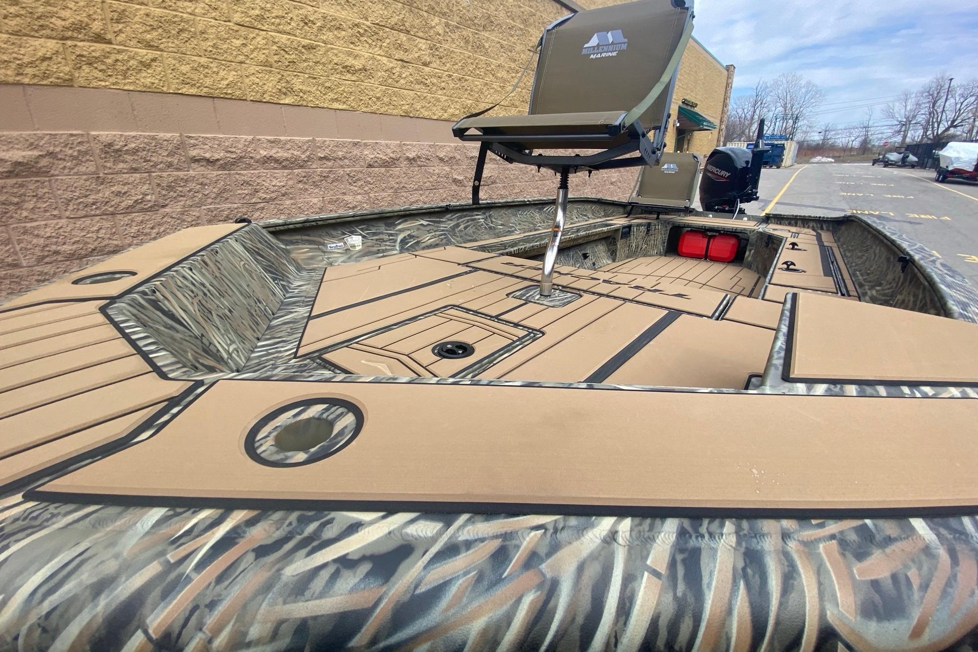 2026 Tracker Grizzly 1756 T Marsh boat with camo design and elevated seat.
