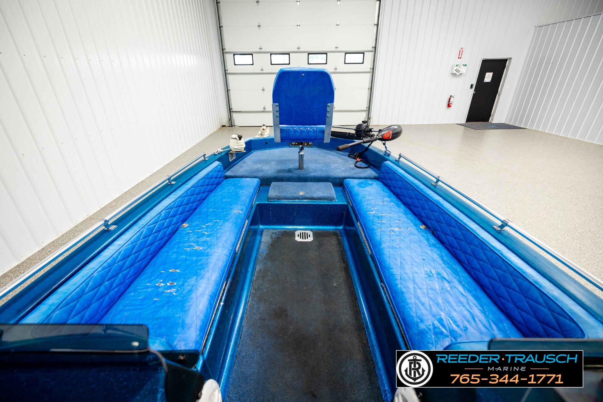 1980 Ranger 175 VS boat interior with blue seating in a garage setting.