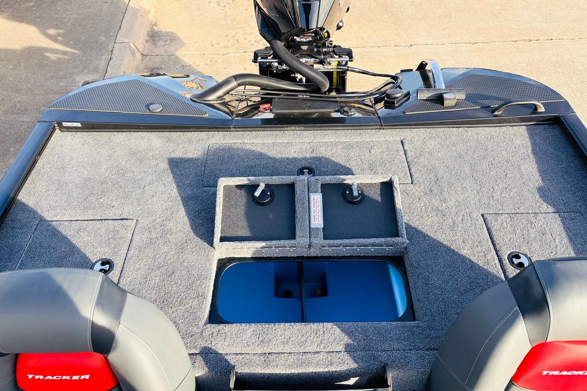 2025 Tracker Savage 215 boat interior with storage compartments and motor.
