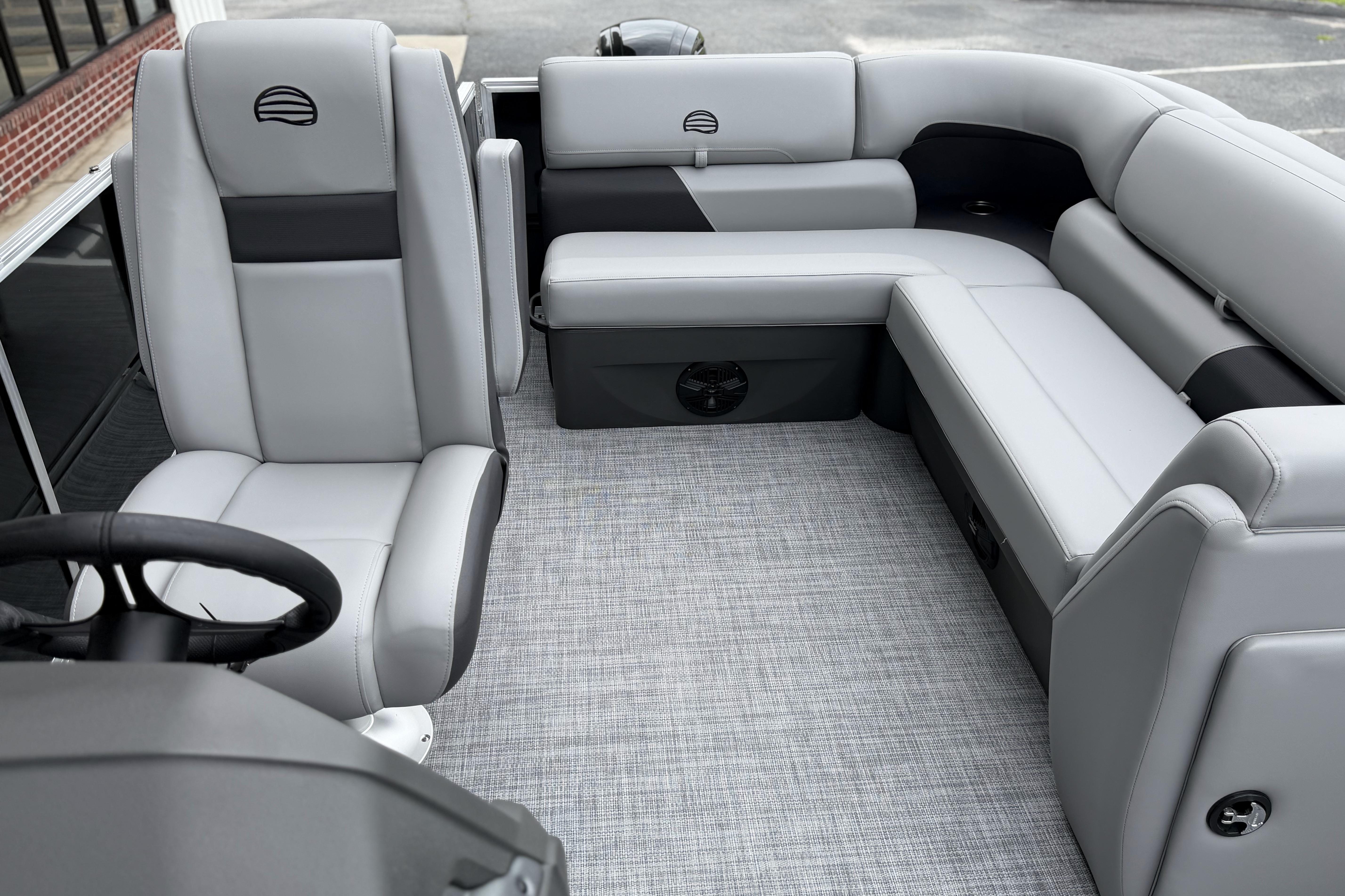 2026 Sun Tracker Party Barge 20 DLX interior with gray seating and modern design.